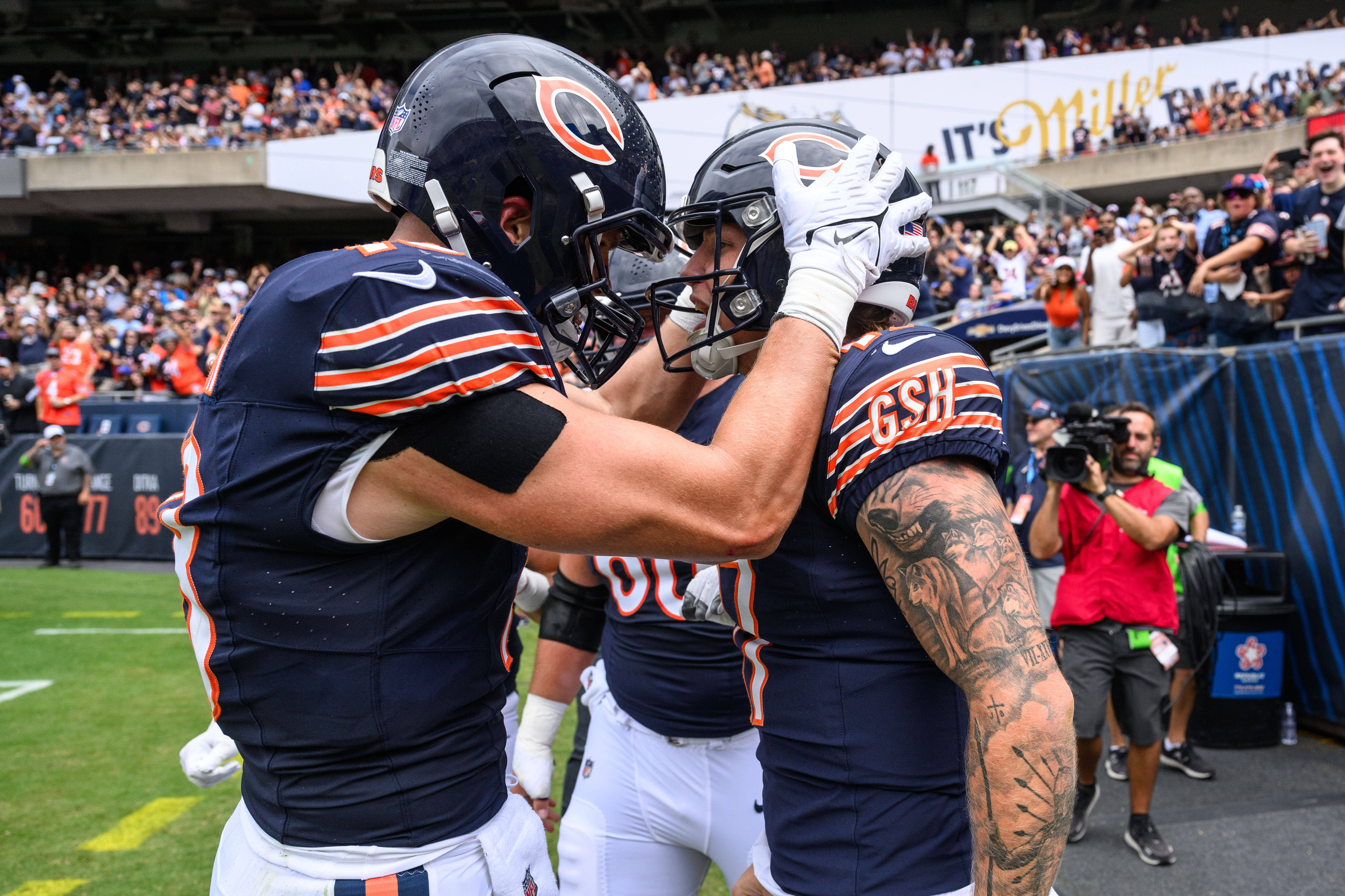 Aug 26, 2023; Chicago, Illinois, USA; Chicago Bears quarterback Tyson Bagent (17) celebrates with tight end Robert Tonyan (18) after scoring a rushing touchdown against the Buffalo Bills during the second quarter at Soldier Field.