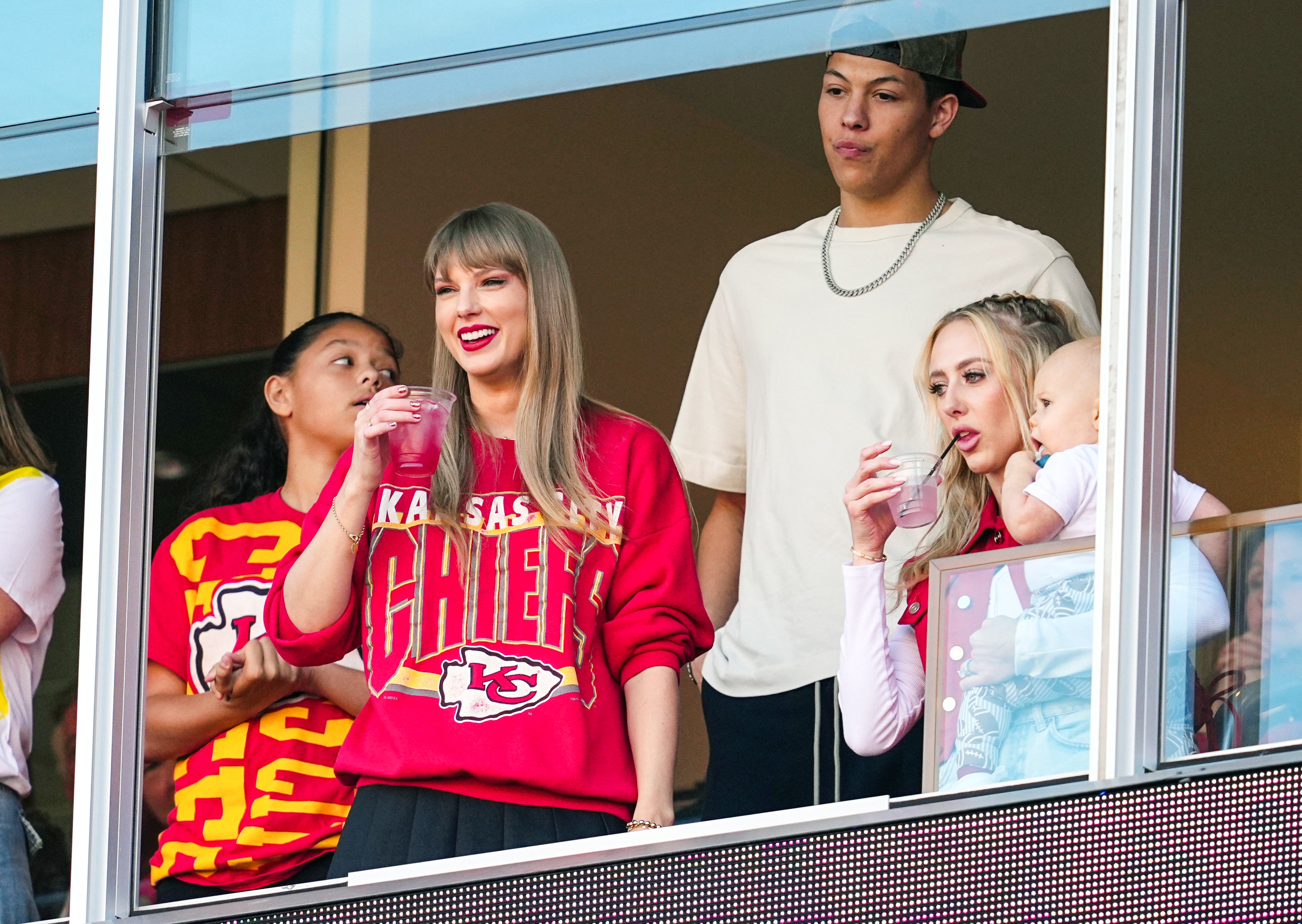 Oct 22, 2023; Kansas City, Missouri, USA; Recording artist Taylor Swift watches the action with Jackson Mahomes and Brittany Mahomes during the first half at GEHA Field at Arrowhead Stadium.