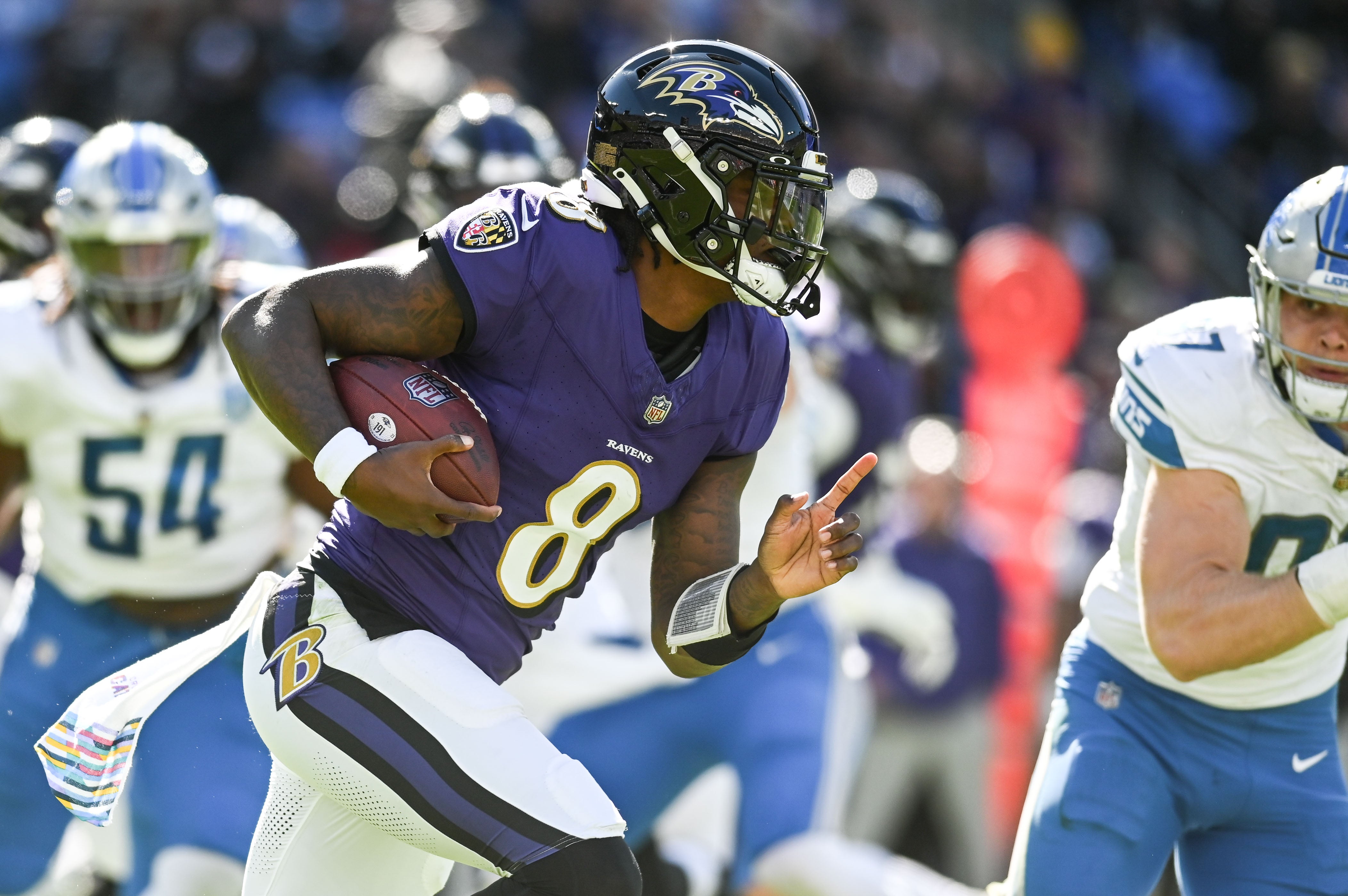 Baltimore Ravens quarterback Lamar Jackson (8) rushes during the first half against the Detroit Lions at M&T Bank Stadium.