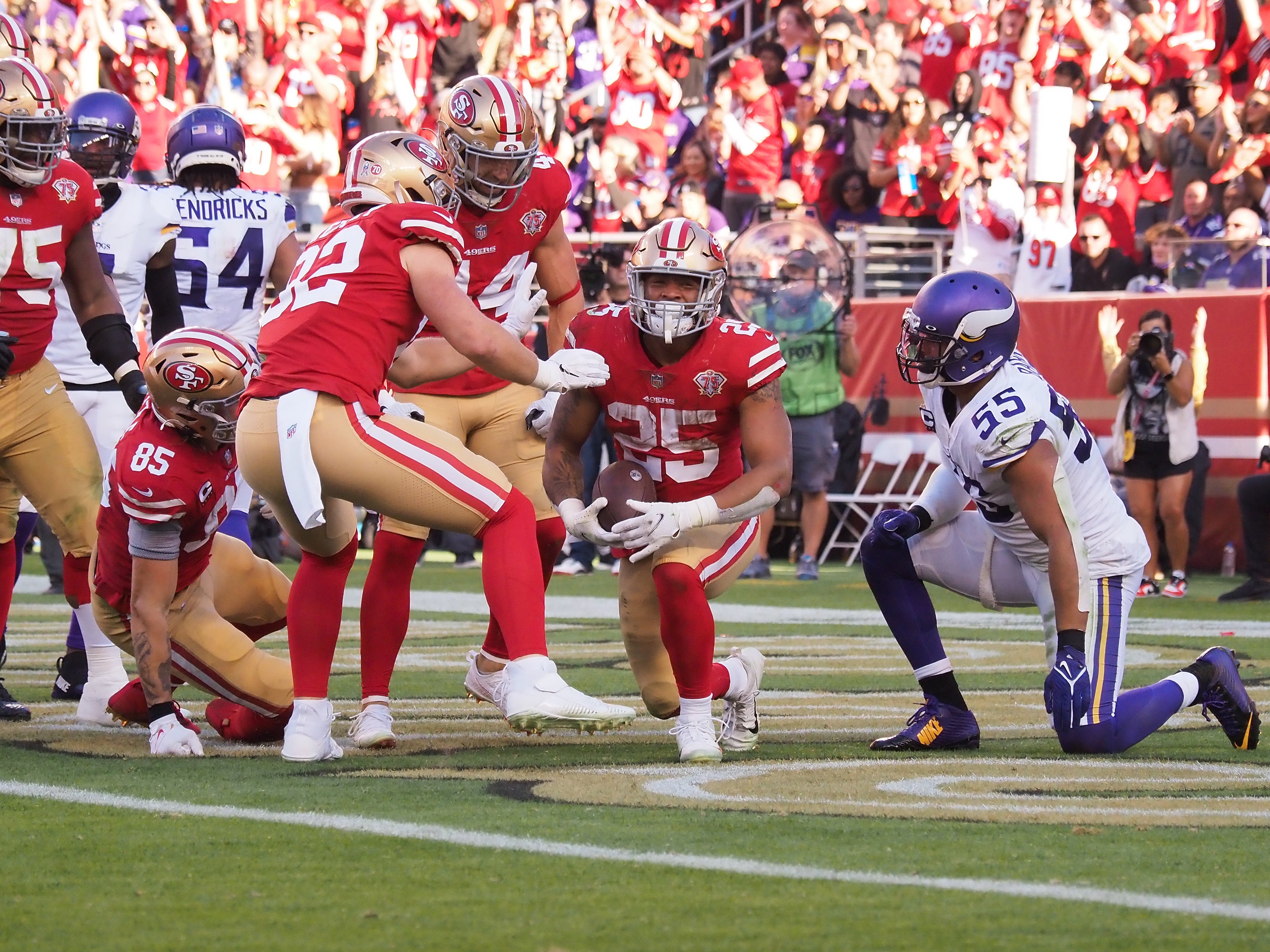 Nov 28, 2021; Santa Clara, California, USA; San Francisco 49ers running back Eli Mitchell (25) celebrates after scoring a touchdown against the Minnesota Vikings during the third quarter at Levi's Stadium.