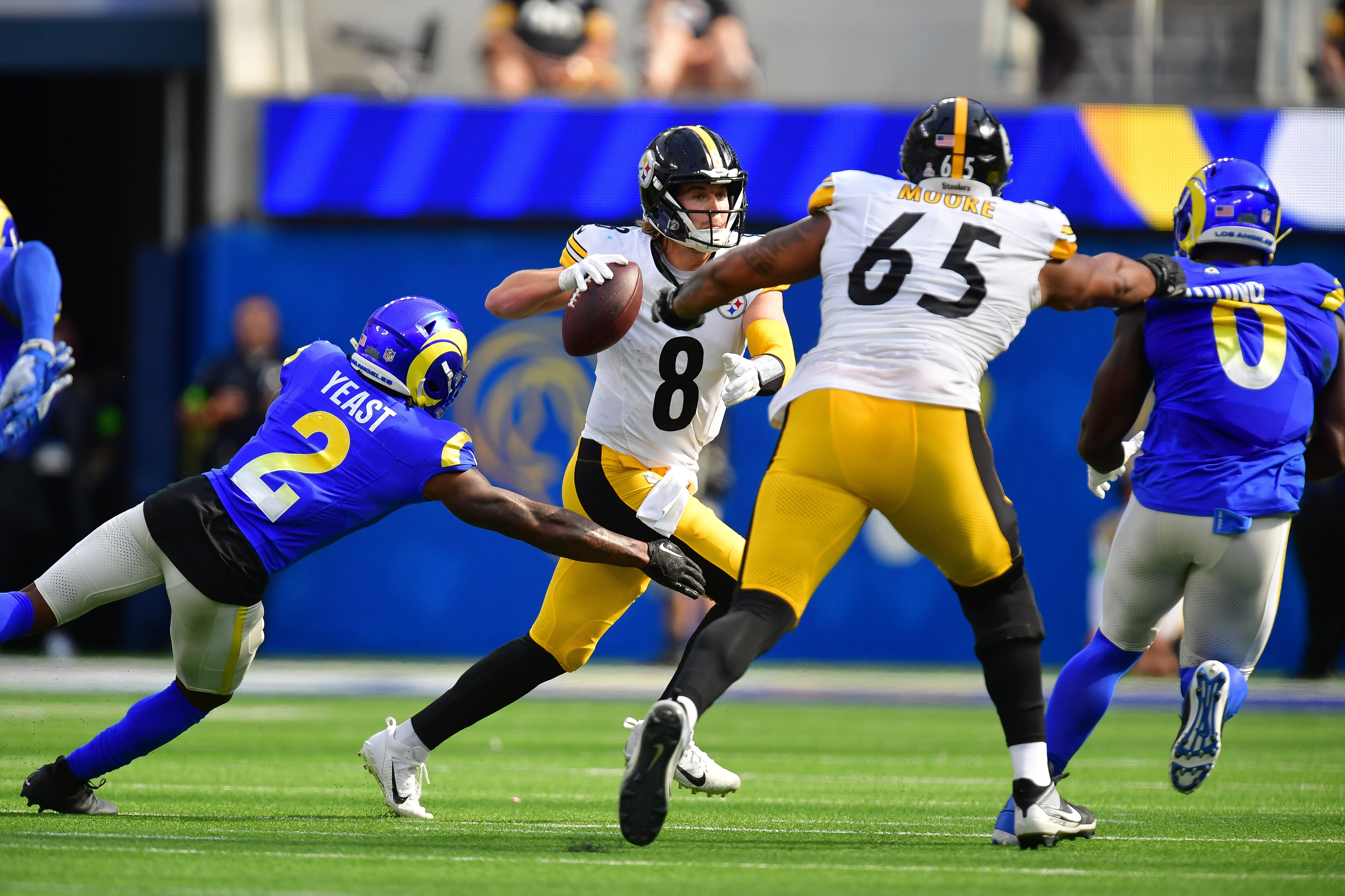 Oct 22, 2023; Inglewood, California, USA; Pittsburgh Steelers quarterback Kenny Pickett (8) runs out to pass as Los Angeles Rams safety Russ Yeast (2) moves in during the first half at SoFi Stadium. Mandatory Credit: Gary A. Vasquez-USA TODAY Sports