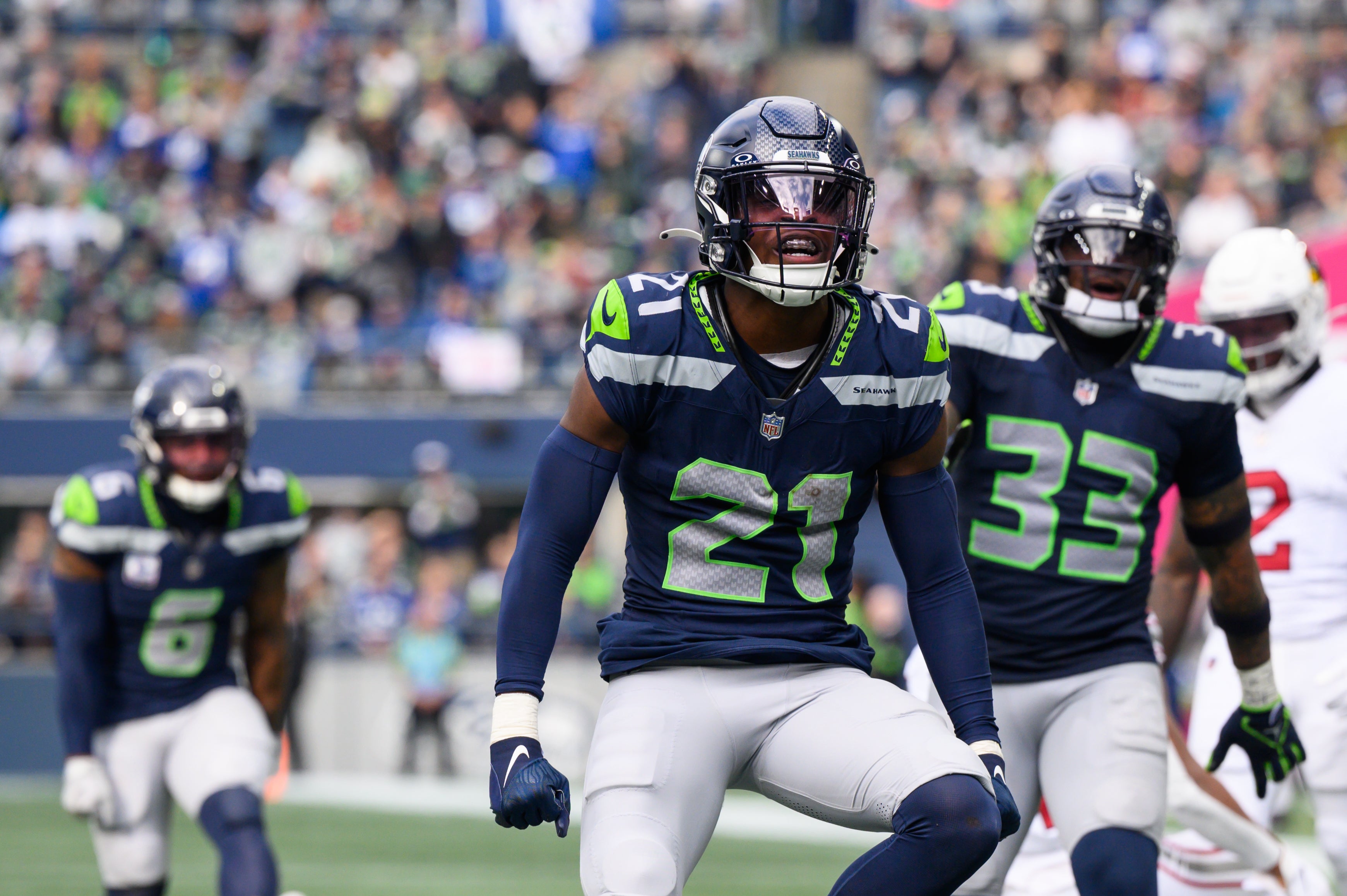 Oct 22, 2023; Seattle, Washington, USA; Seattle Seahawks cornerback Devon Witherspoon (21) celebrates after the defense made a play against the Arizona Cardinals during the second half at Lumen Field. Mandatory Credit: Steven Bisig-USA TODAY Sports