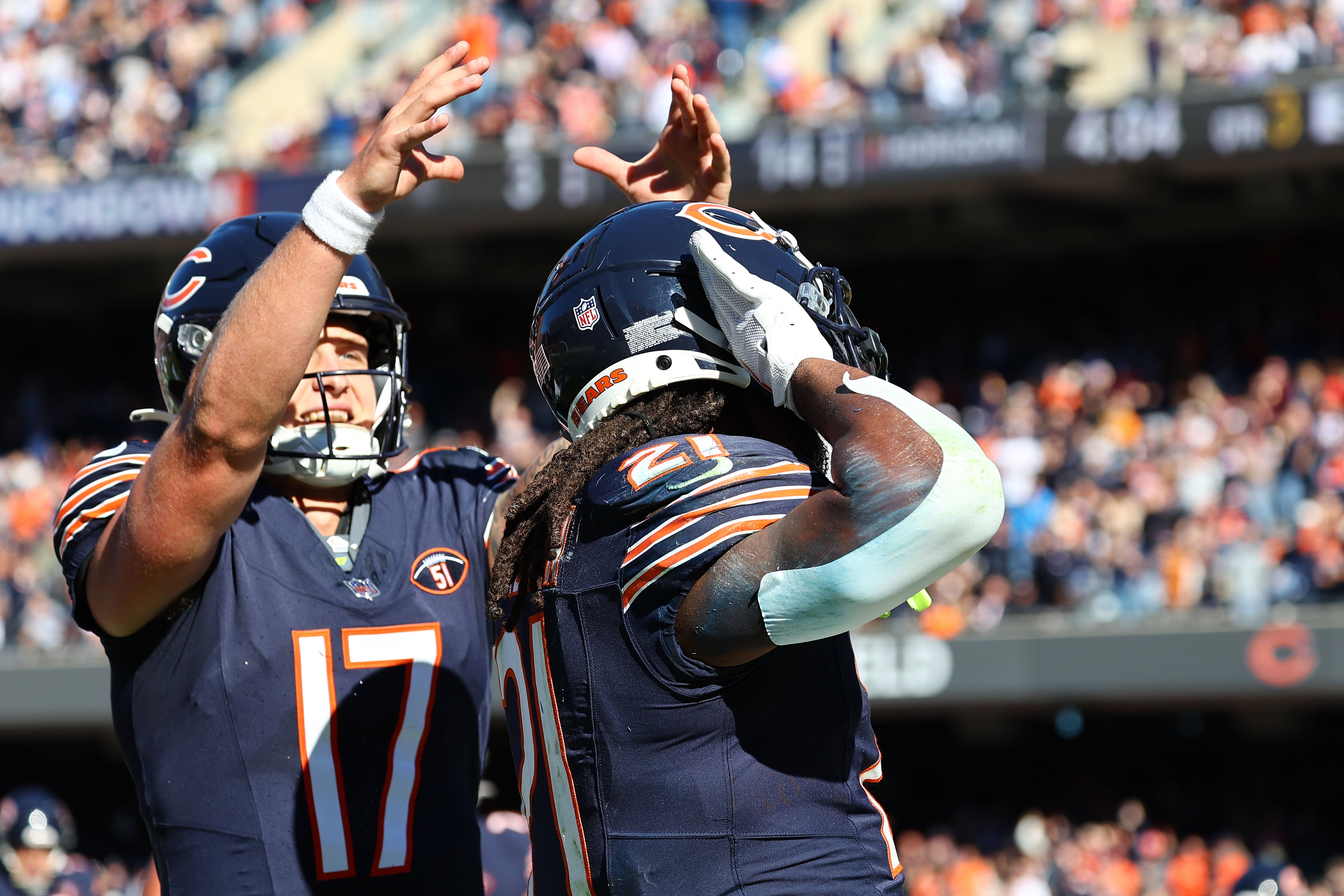 Oct 22, 2023; Chicago, Illinois, USA; Chicago Bears running back D'Onta Foreman (21) and quarterback Tyson Bagent (17) react after a touchdown against the Las Vegas Raiders in the second half at Soldier Field.