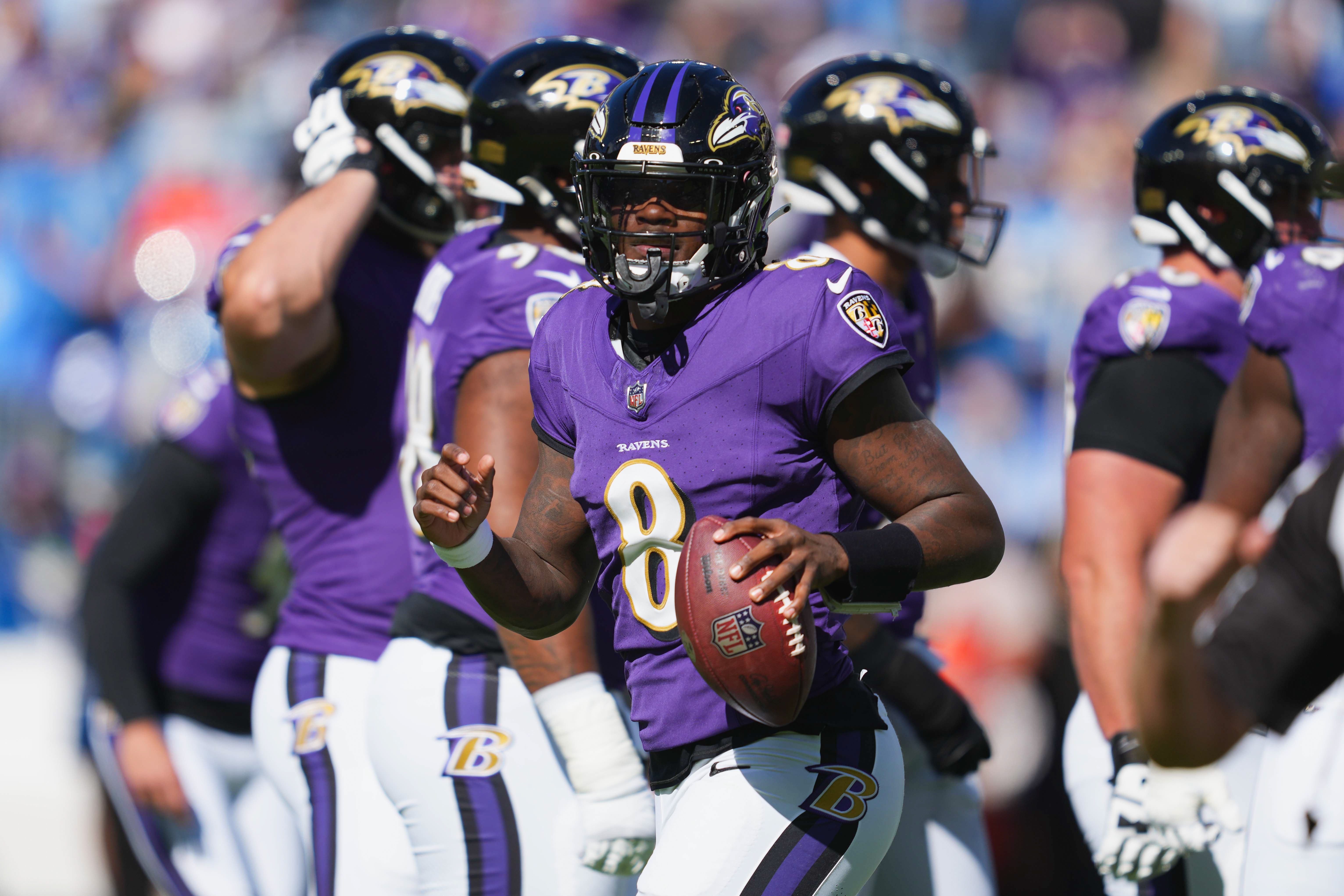Baltimore Ravens quarterback Lamar Jackson (8) runs to the sideline after a first quarter touchdown run against the Detroit Lions at M&T Bank Stadium.