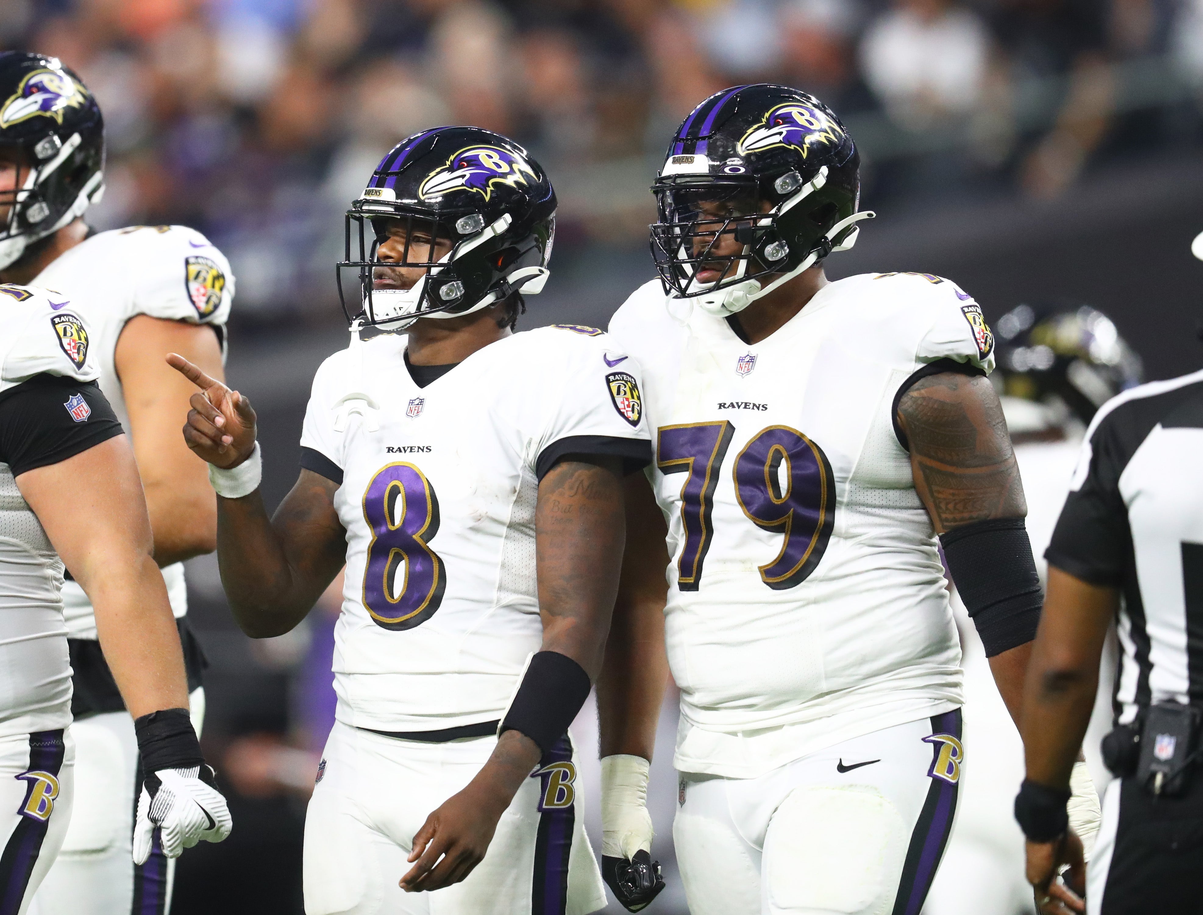 Baltimore Ravens quarterback Lamar Jackson (8) and offensive tackle Ronnie Stanley (79) against the Las Vegas Raiders during Monday Night Football at Allegiant Stadium.