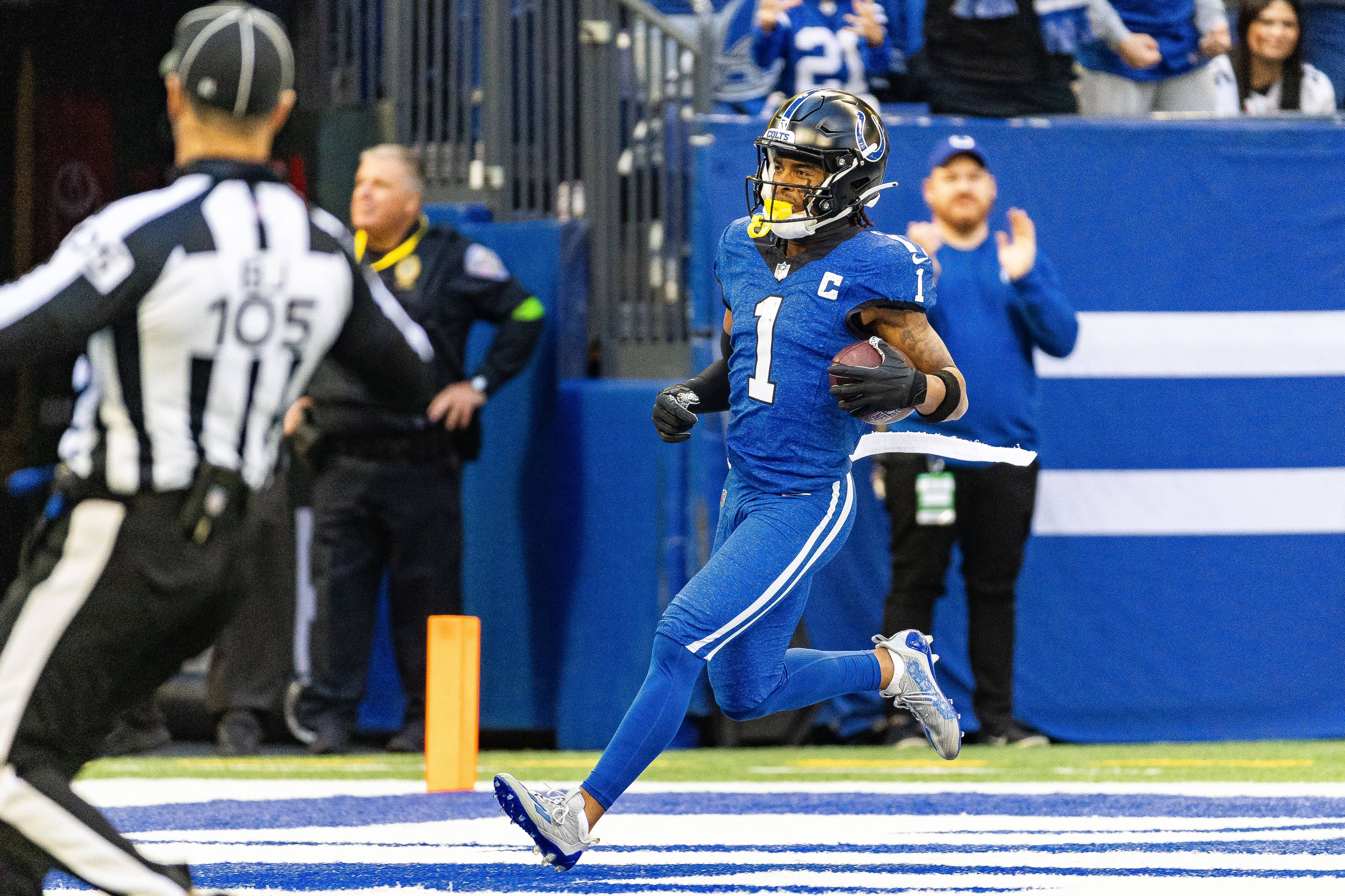 Oct 22, 2023; Indianapolis, Indiana, USA; Indianapolis Colts wide receiver Josh Downs (1) runs the ball for a touchdown in the first quarter against the Cleveland Browns at Lucas Oil Stadium.