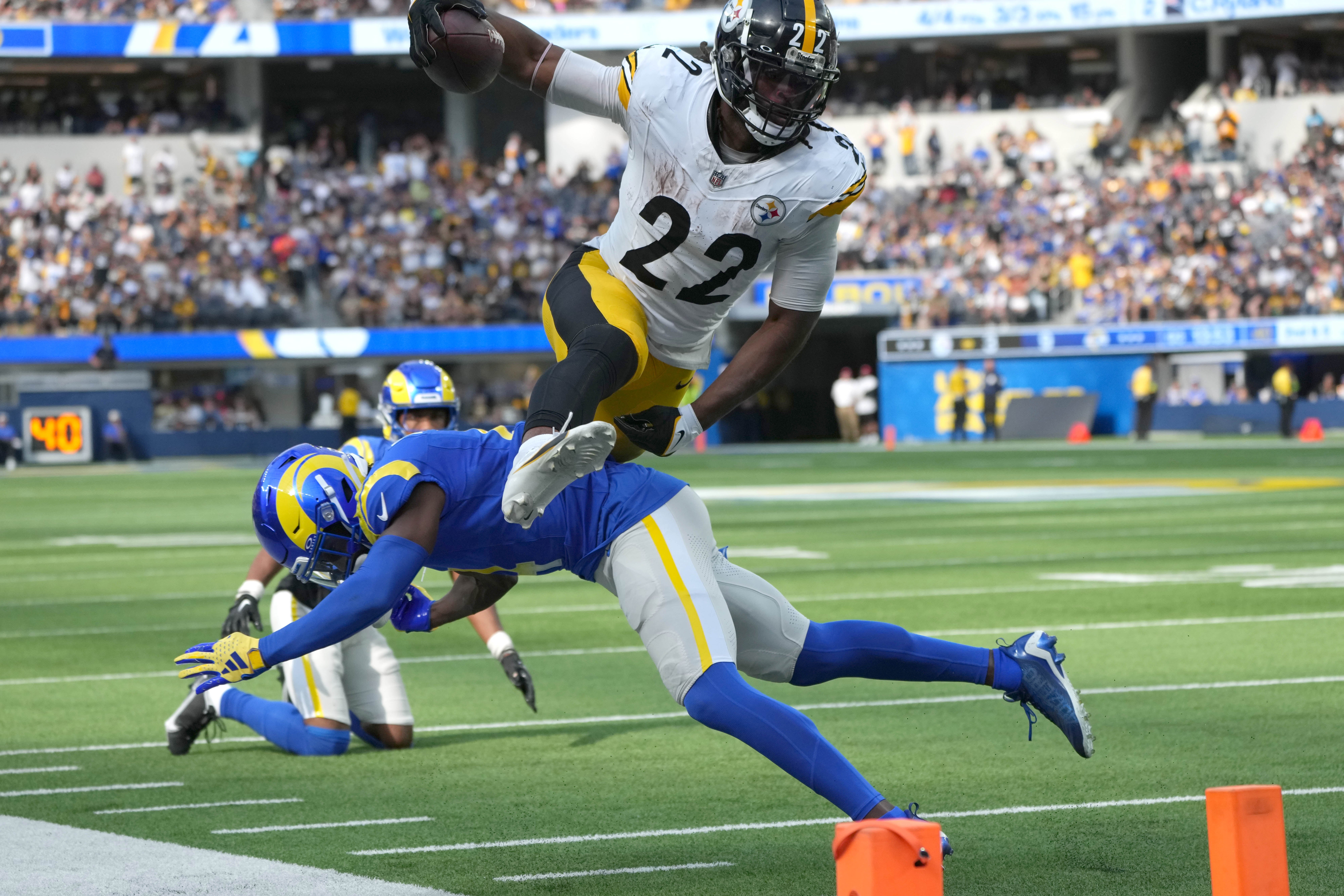 Oct 22, 2023; Inglewood, California, USA; Pittsburgh Steelers running back Najee Harris (22) leaps over Los Angeles Rams safety Jordan Fuller (4) in the second half SoFi Stadium. Mandatory Credit: Kirby Lee-USA TODAY Sports