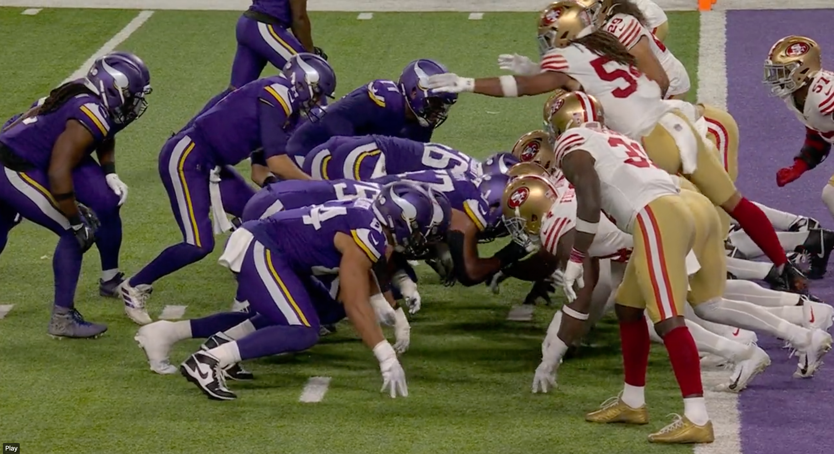 Fred Warner leaps to stop Kirk Cousins in the 49ers' Week 7 game with the Vikings.