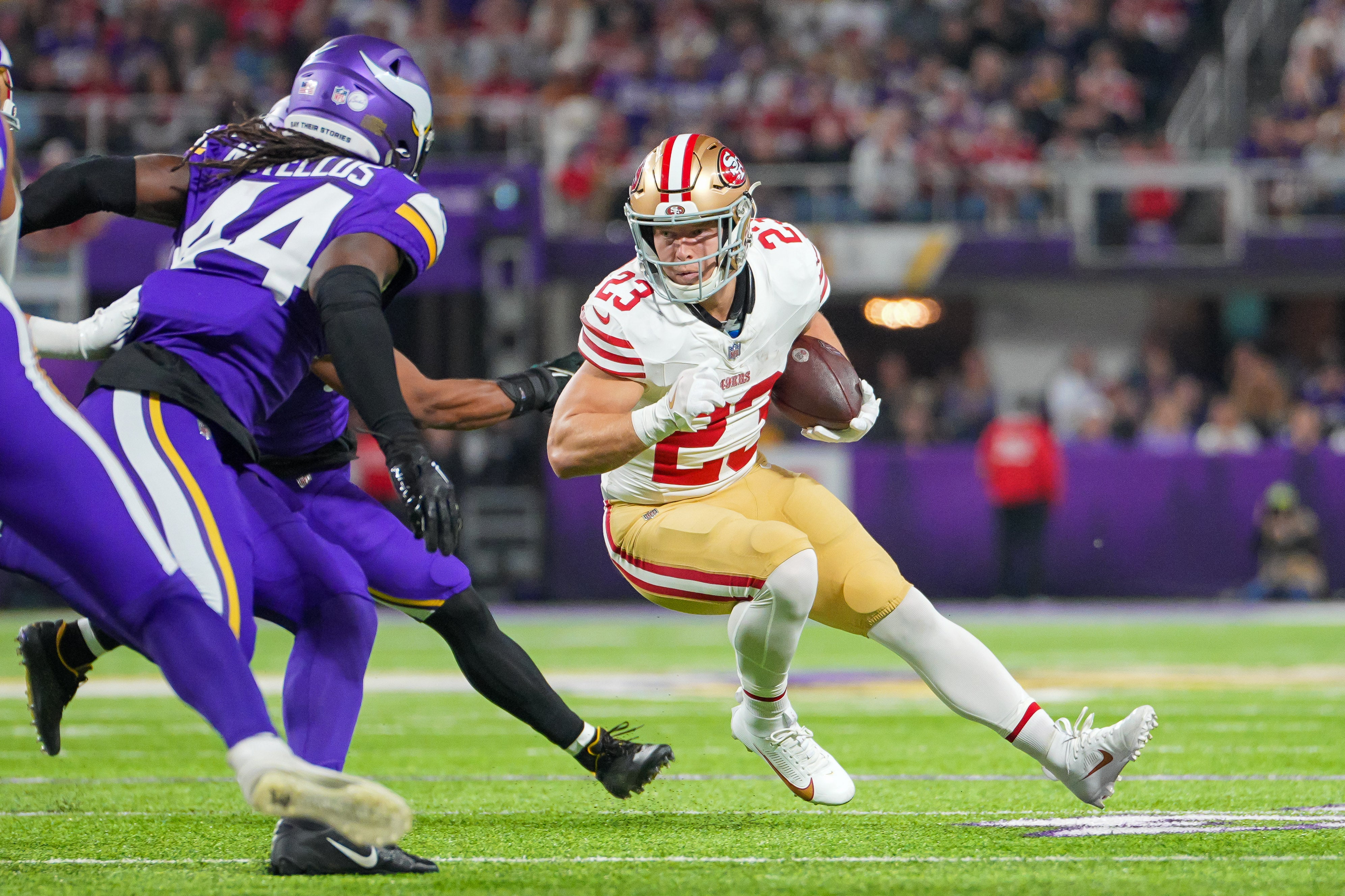 Oct 23, 2023; Minneapolis, Minnesota, USA; San Francisco 49ers running back Christian McCaffrey (23) runs with the ball against the Minnesota Vikings in the first quarter at U.S. Bank Stadium.