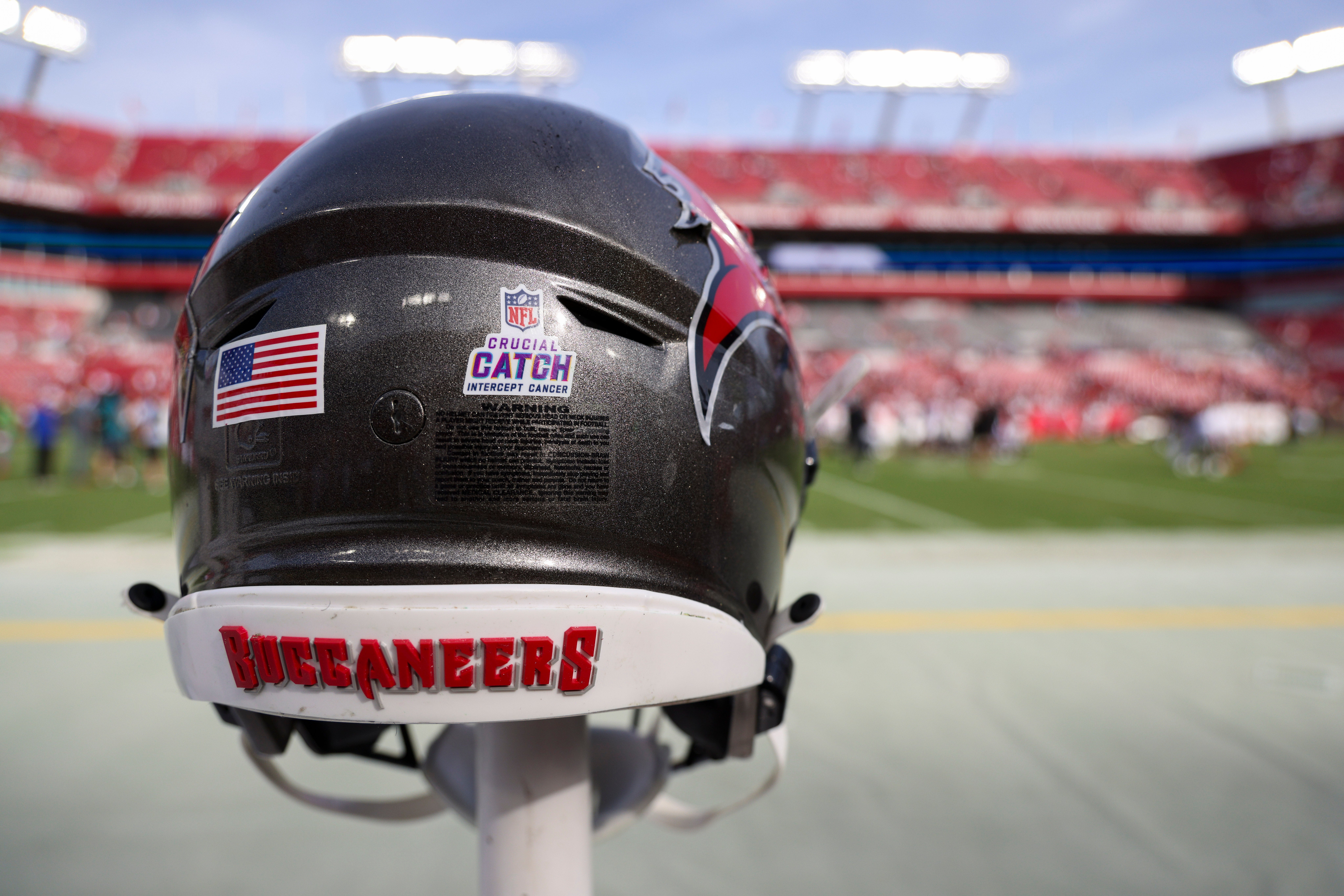 Oct 22, 2023; Tampa, Florida, USA; Tampa Bay Buccaneers with the NFL Crucial Catch logo sits on the sidelines after a game against the Atlanta Falcons at Raymond James Stadium. Mandatory Credit: Nathan Ray Seebeck-USA TODAY Sports