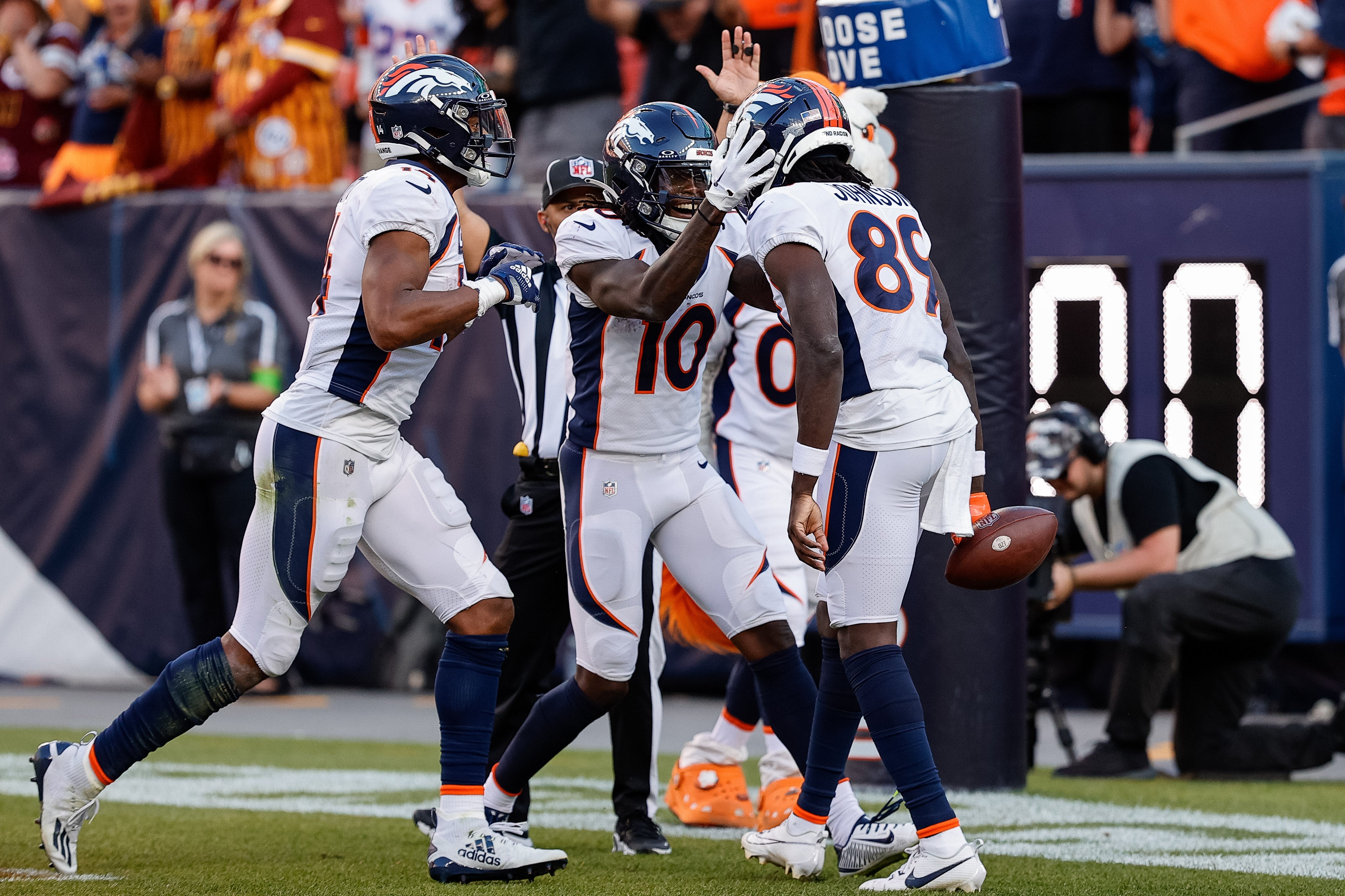 Sep 17, 2023; Denver, Colorado, USA; Denver Broncos wide receiver Brandon Johnson (89) celebrates his touchdown with wide receiver Jerry Jeudy (10) and wide receiver Courtland Sutton (14) in the fourth quarter against the Washington Commanders at Empower Field at Mile High. Mandatory Credit: Isaiah J. Downing-USA TODAY Sports