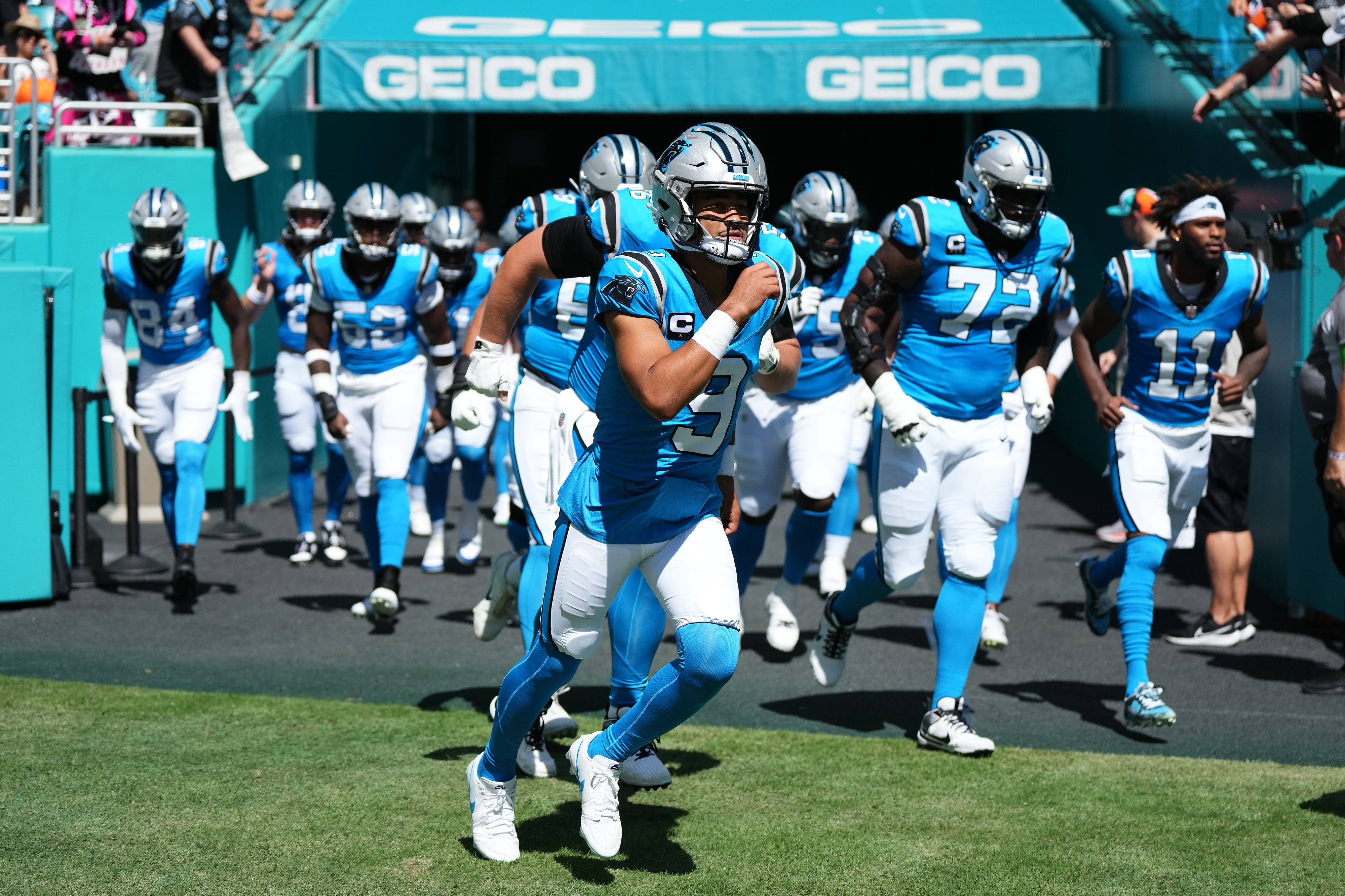 Oct 15, 2023; Miami Gardens, Florida, USA; Carolina Panthers quarterback Bryce Young (9) leads his team onto the field prior to the game against the Miami Dophins at Hard Rock Stadium. Mandatory Credit: Jasen Vinlove-USA TODAY Sports