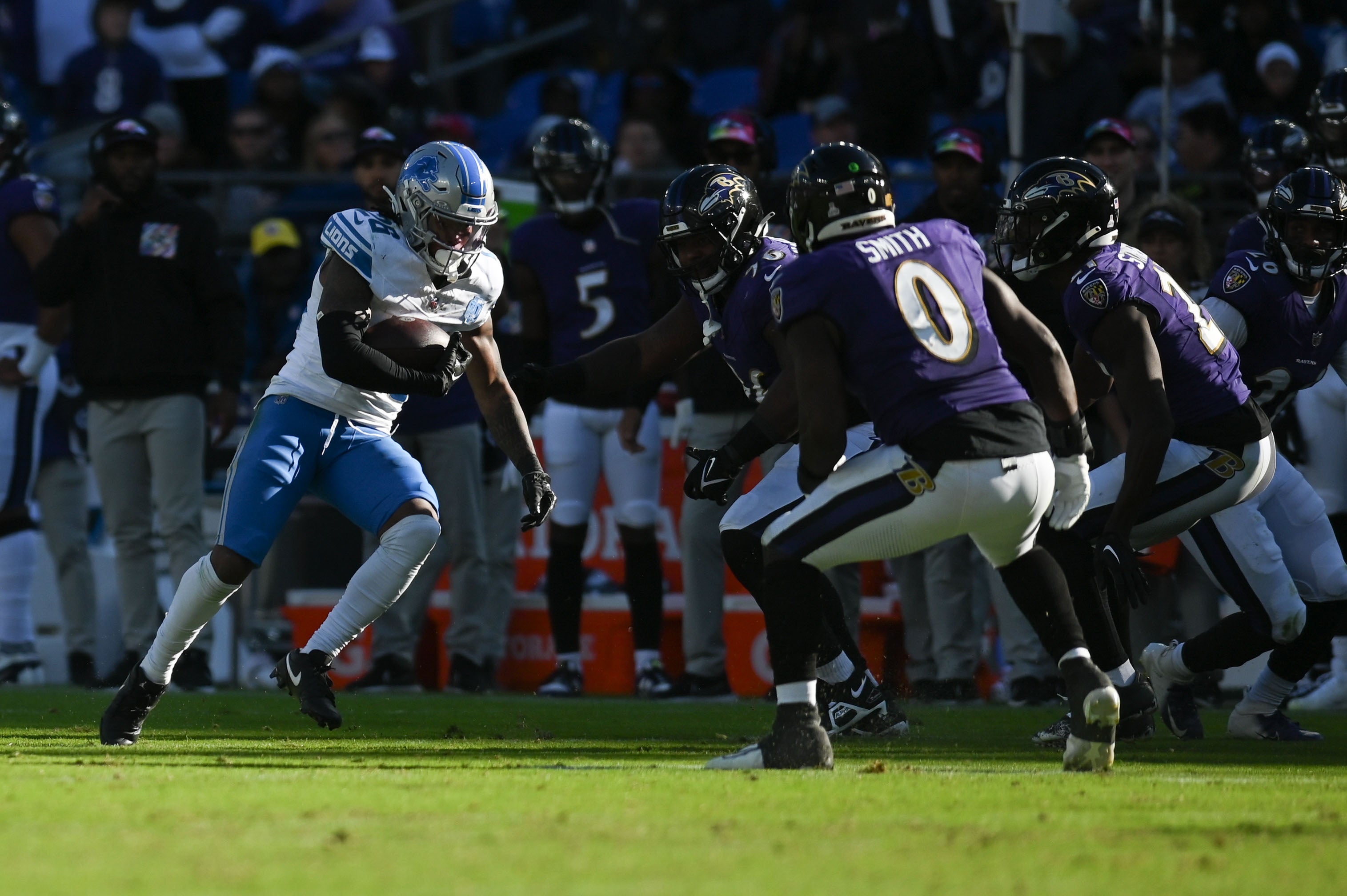 Detroit Lions running back Jahmyr Gibbs (26) cuts as Baltimore Ravens linebacker Roquan Smith (0) defends during the second half at M&T Bank Stadium.