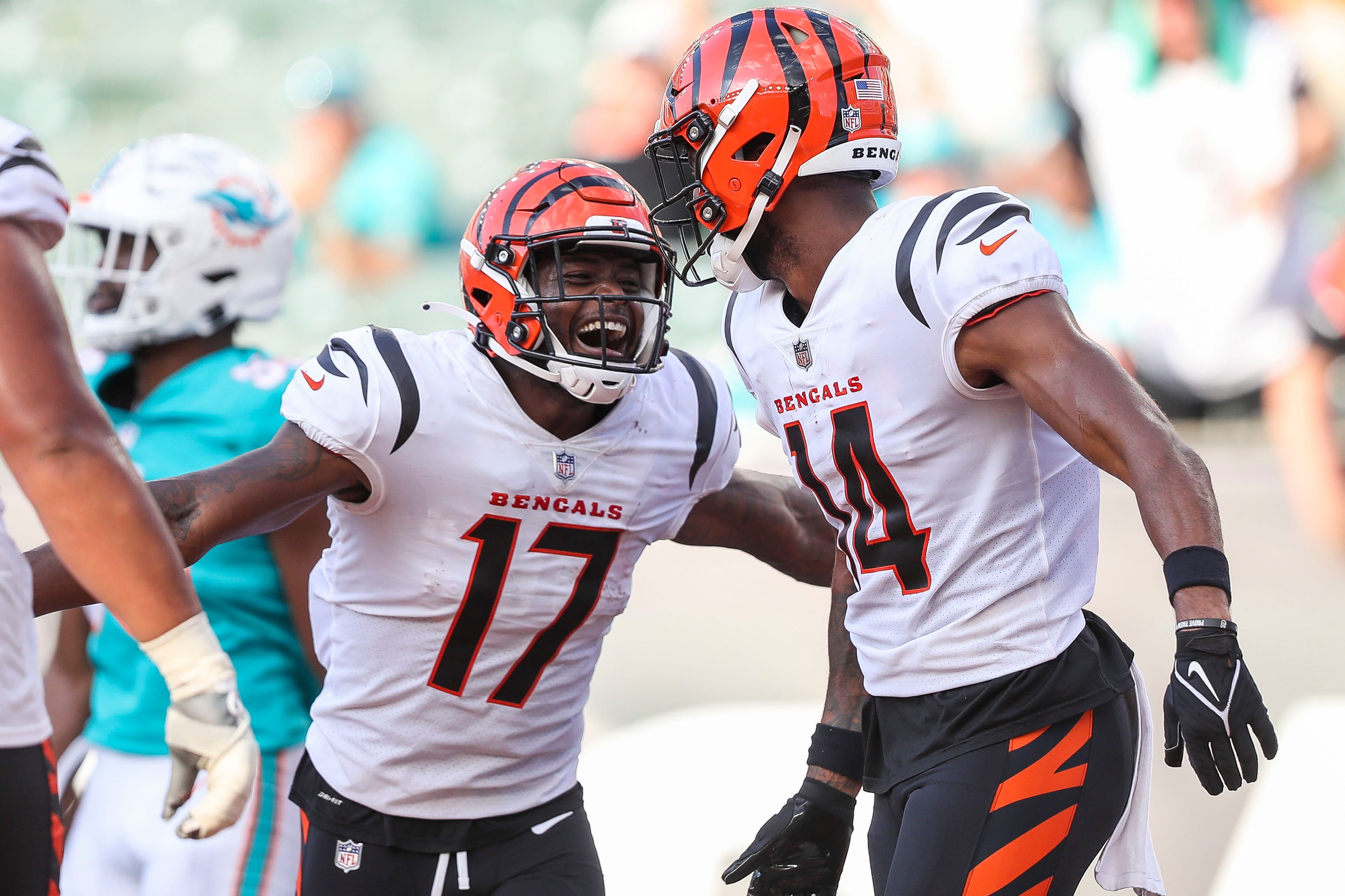 Aug 29, 2021; Cincinnati, Ohio, USA; Cincinnati Bengals wide receiver Stanley Morgan (17) celebrates with wide receiver Scotty Washington (14) after a touchdown against the Miami Dolphins in the second half at Paul Brown Stadium. Mandatory Credit: Katie Stratman-USA TODAY Sports  