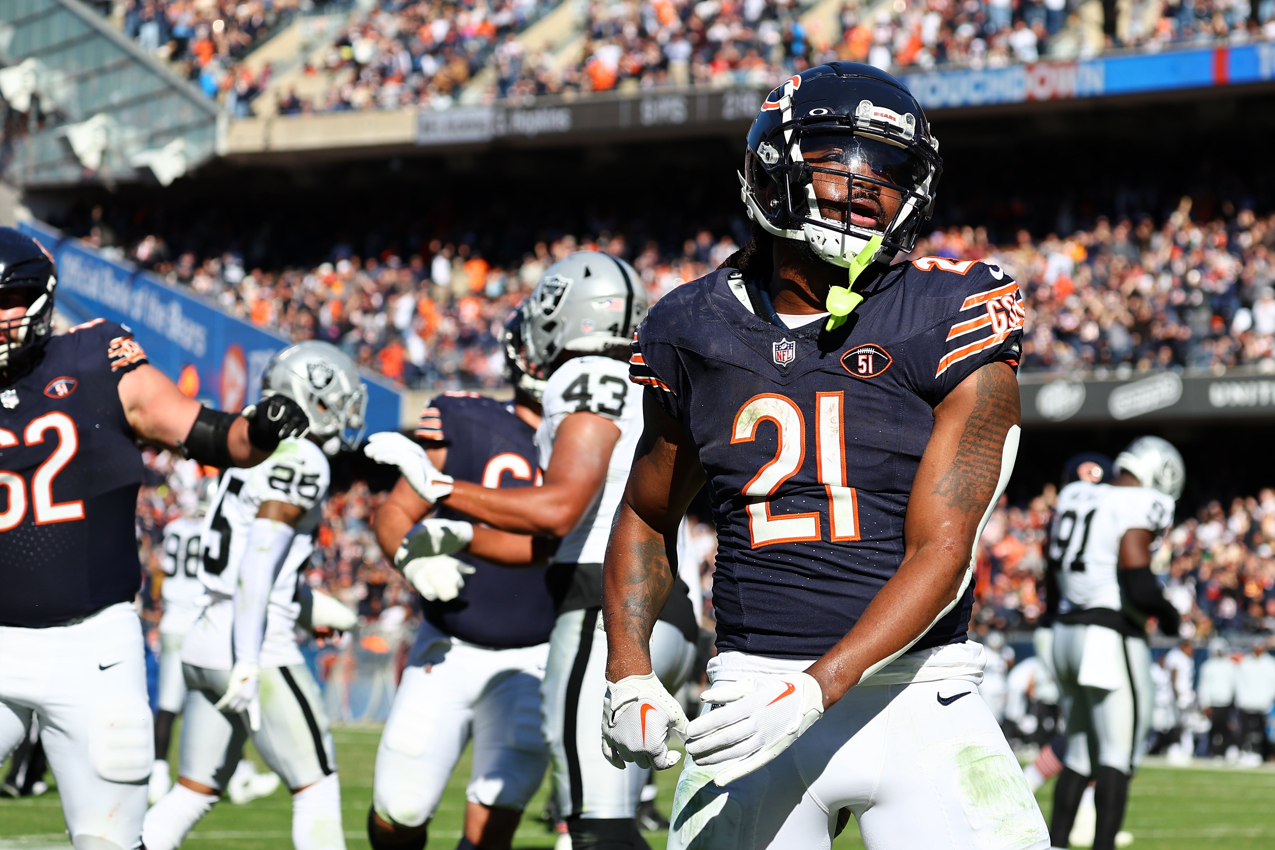 Oct 22, 2023; Chicago, Illinois, USA; Chicago Bears running back D'Onta Foreman (21) reacts after scoring a touchdown against the Las Vegas Raiders in the second half at Soldier Field.