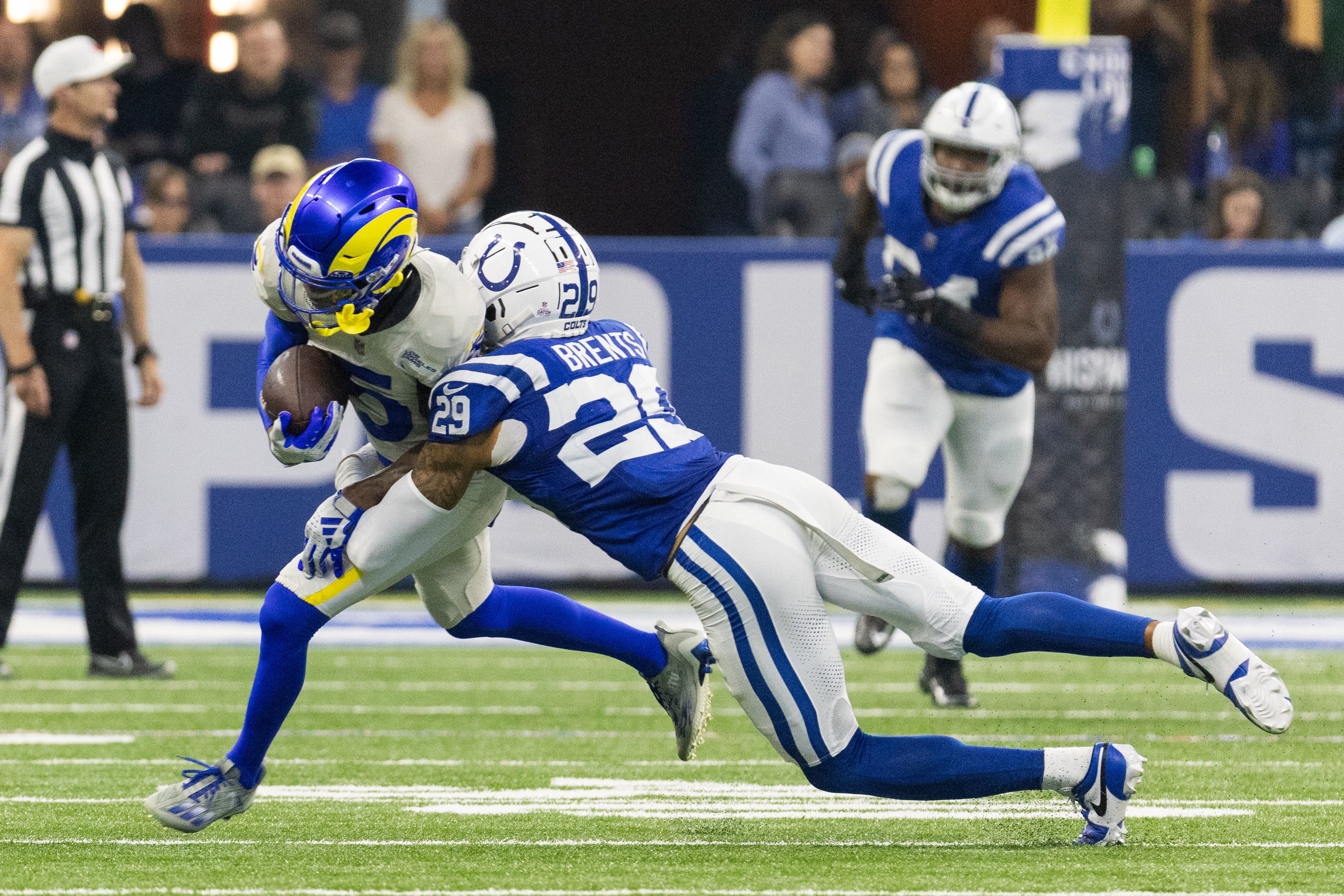 Oct 1, 2023; Indianapolis, Indiana, USA; Los Angeles Rams wide receiver Tutu Atwell (5) runs with the ball after the catch while Indianapolis Colts cornerback JuJu Brents (29) defends in the second quarter at Lucas Oil Stadium.