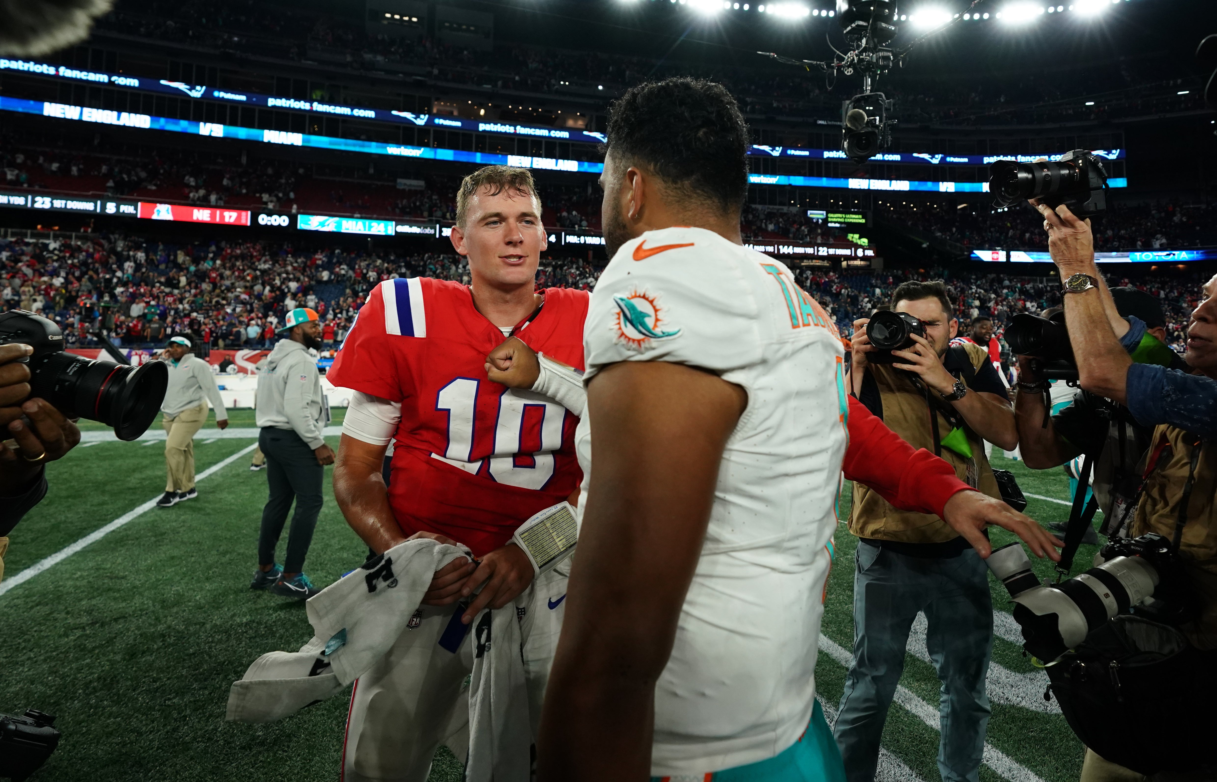 Mac Jones and Tua Tagovailoa shake hands after the Week 2 game at Gillette Stadium