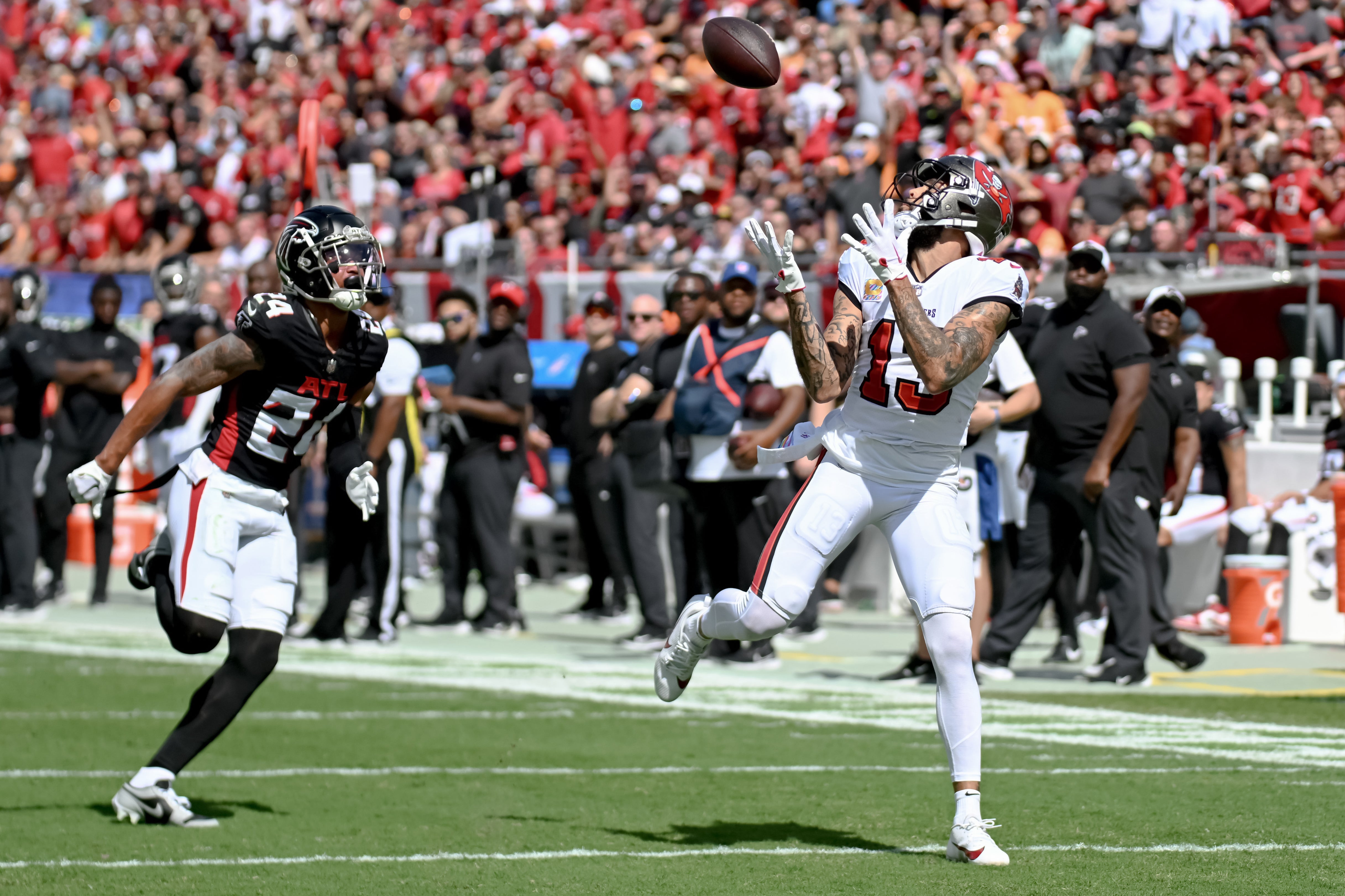 Oct 22, 2023; Tampa, Florida, USA; Tampa Bay Buccaneers wide receiver Mike Evans (13) catches a touchdown pass in the first quarter against the Atlanta Falcons at Raymond James Stadium. Mandatory Credit: Jonathan Dyer-USA TODAY Sports