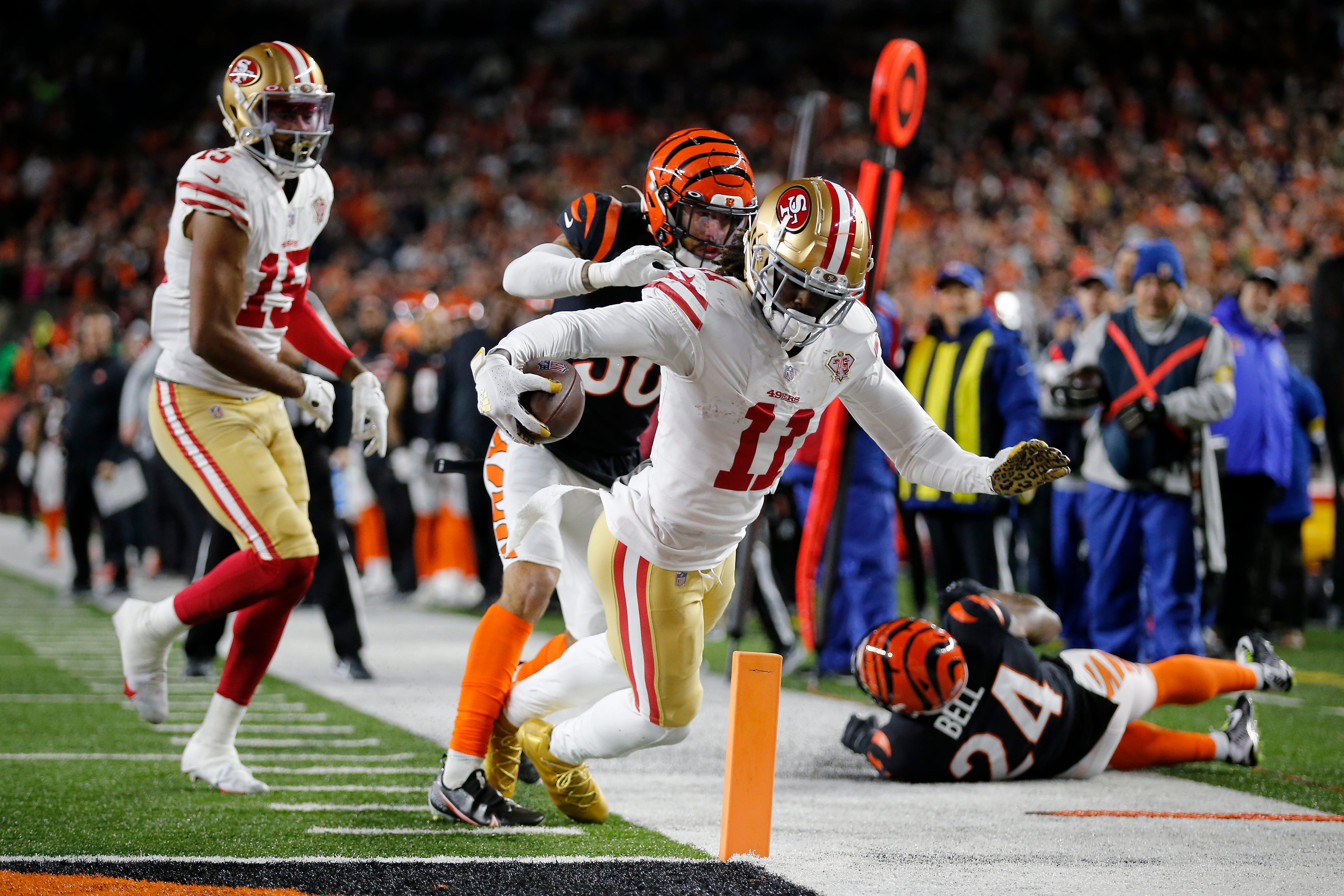 San Francisco 49ers wide receiver Brandon Aiyuk (11) dives to break the plane on for the game-winning touchdown in overtime of the NFL Week 14 game between the Cincinnati Bengals and the San Francisco 49ers at Paul Brown Stadium in downtown Cincinnati on Sunday, Dec. 12, 2021. The Bengals tied the game in the fourth quarter, but eventually fell to the 49ers in overtime, 26-23. San Francisco 49ers At Cincinnati Bengals
