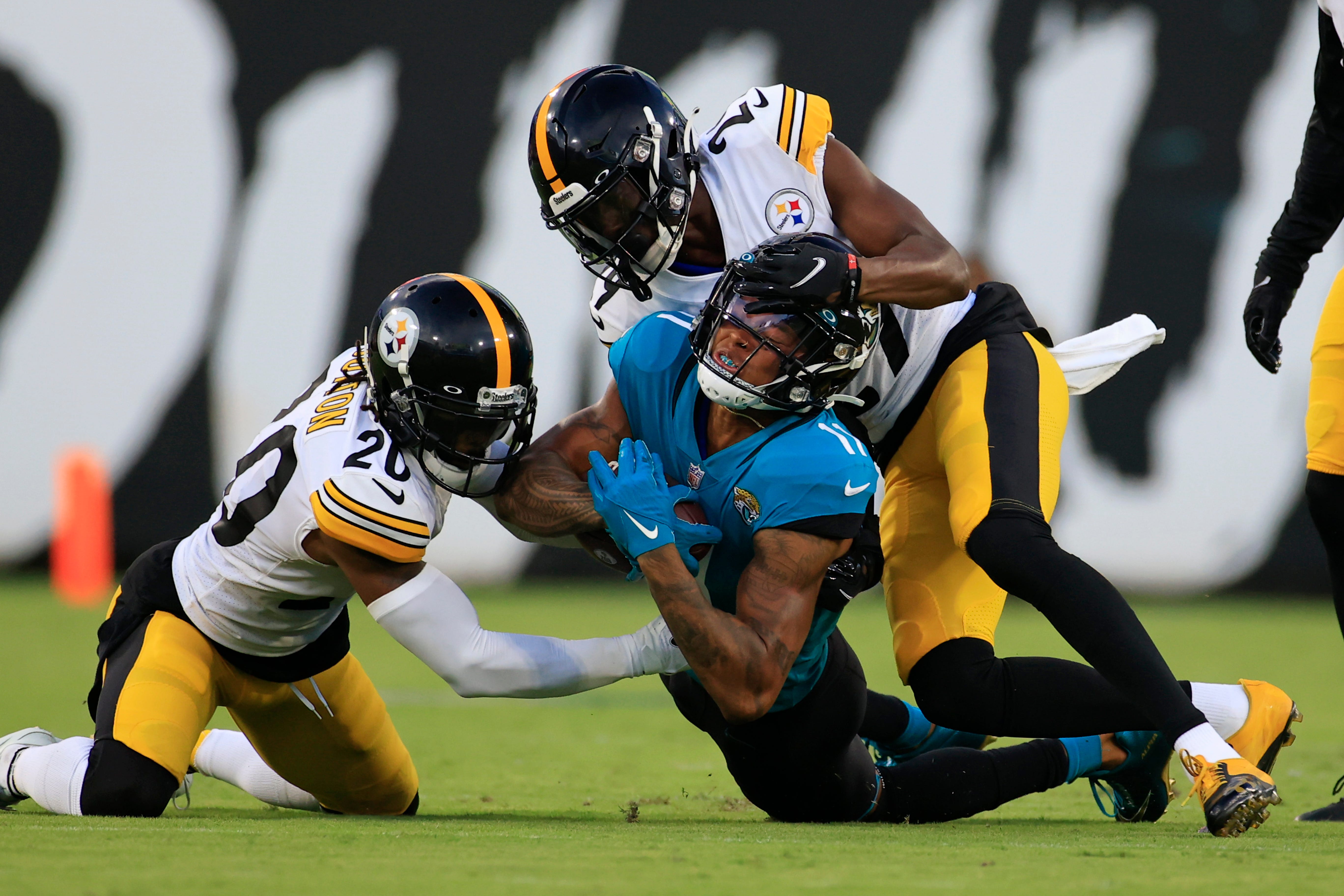 Jacksonville Jaguars wide receiver Marvin Jones Jr. #11 is tackled by Pittsburgh Steelers cornerback Cameron Sutton #20 and cornerback Levi Wallace #29 during the first quarter of an NFL preseason game Saturday, Aug. 20, 2022 at TIAA Bank Field in Jacksonville. [Corey Perrine/Florida Times-Union] Jki 082022 Jags Vs Steelers Cp 63