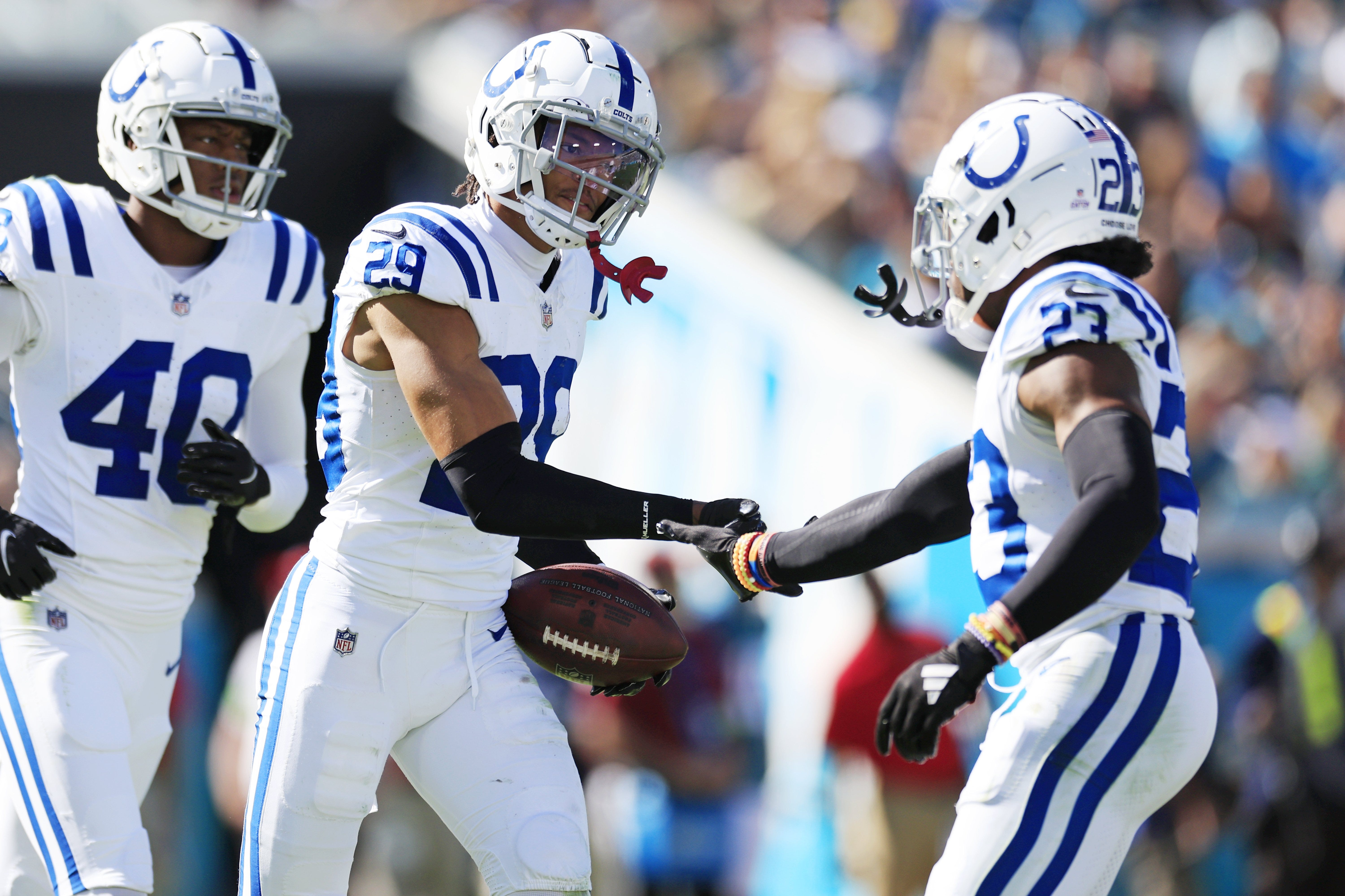 Indianapolis Colts cornerback JuJu Brents (29) is congratulated by cornerback Kenny Moore II (23) after picking off Jacksonville Jaguars quarterback Trevor Lawrence (16), not shown, during the fourth quarter of an NFL football matchup Sunday, Oct. 15, 2023 at EverBank Stadium in Jacksonville, Fla. The Jacksonville Jaguars defeated the Indianapolis Colts 37-20.