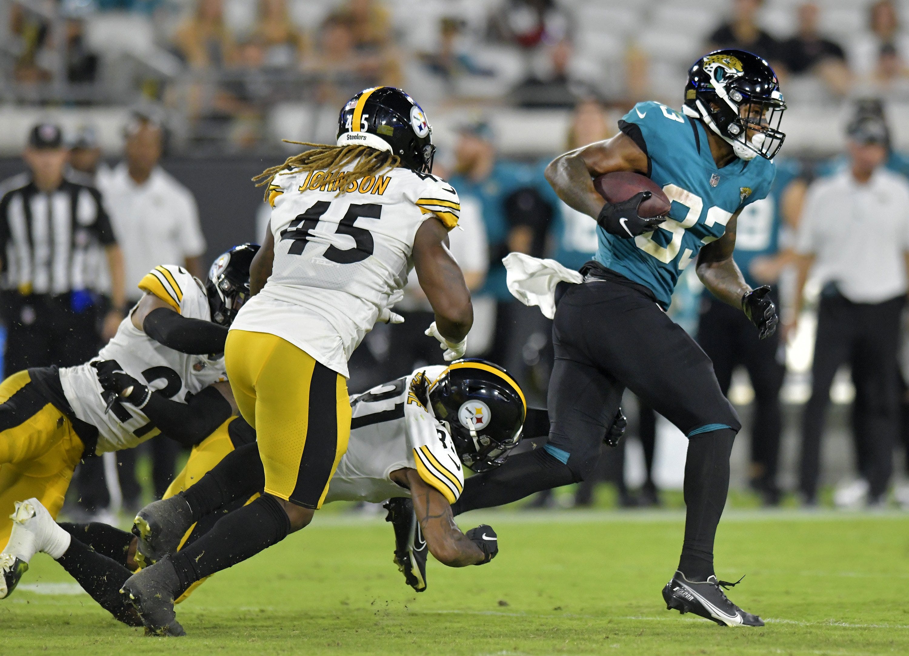 Jacksonville Jaguars wide receiver Tim Jones (83) eludes defenders on a late fourth quarter pass play from quarterback E.J.Perry (4) for 51 yards during fourth quarter action. The Jacksonville Jaguars hosted the Pittsburg Steelers in pre-season football at TIAA Bank Field in Jacksonville, FL Saturday, August 20, 2022. The Steelers led at the half 7-6 with the Jaguars loosing with a final score of 16-15. [Bob Self/Florida Times-Union] Jki 082022 Bs Jags Vs Stee