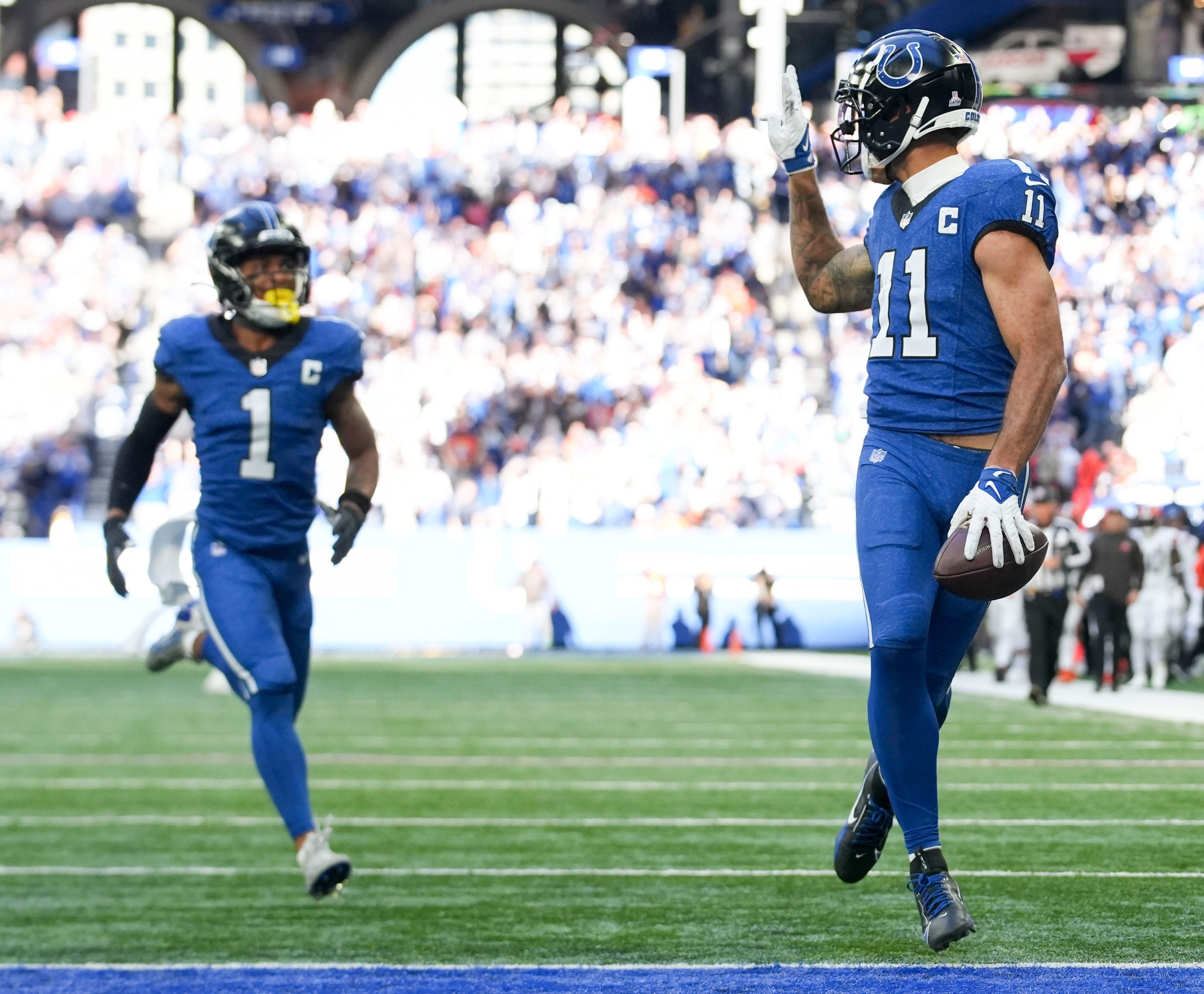 Indianapolis Colts wide receiver Michael Pittman Jr. (11) looks back and throws up a peace sign as he runs into the end zone Sunday, Oct. 22, 2023, during a game against the Cleveland Browns at Lucas Oil Stadium in Indianapolis.