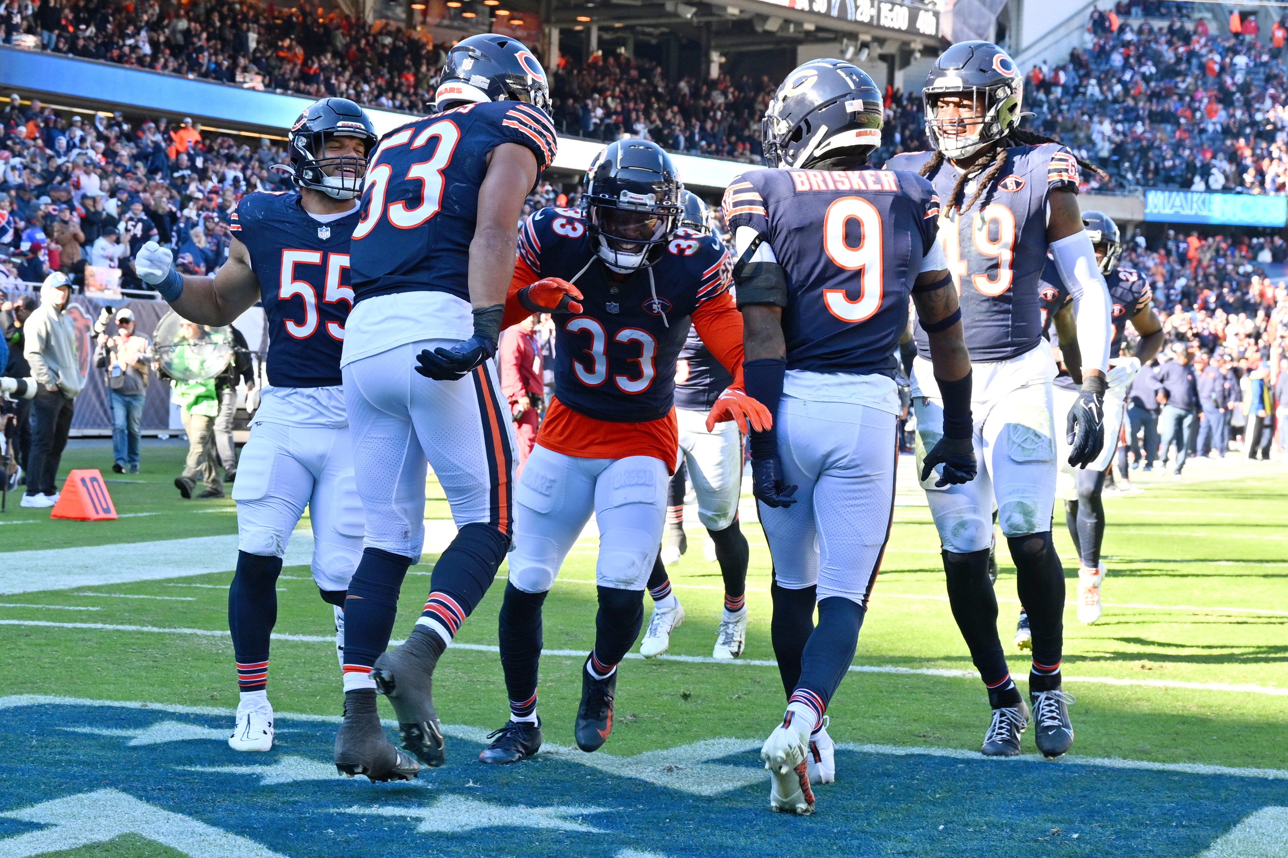 Oct 22, 2023; Chicago, Illinois, USA; Las Vegas Raiders safety Roderic Teamer (33) celebrates with the defense after his second interception of the fourth quarter against the Las Vegas Raiders at Soldier Field.