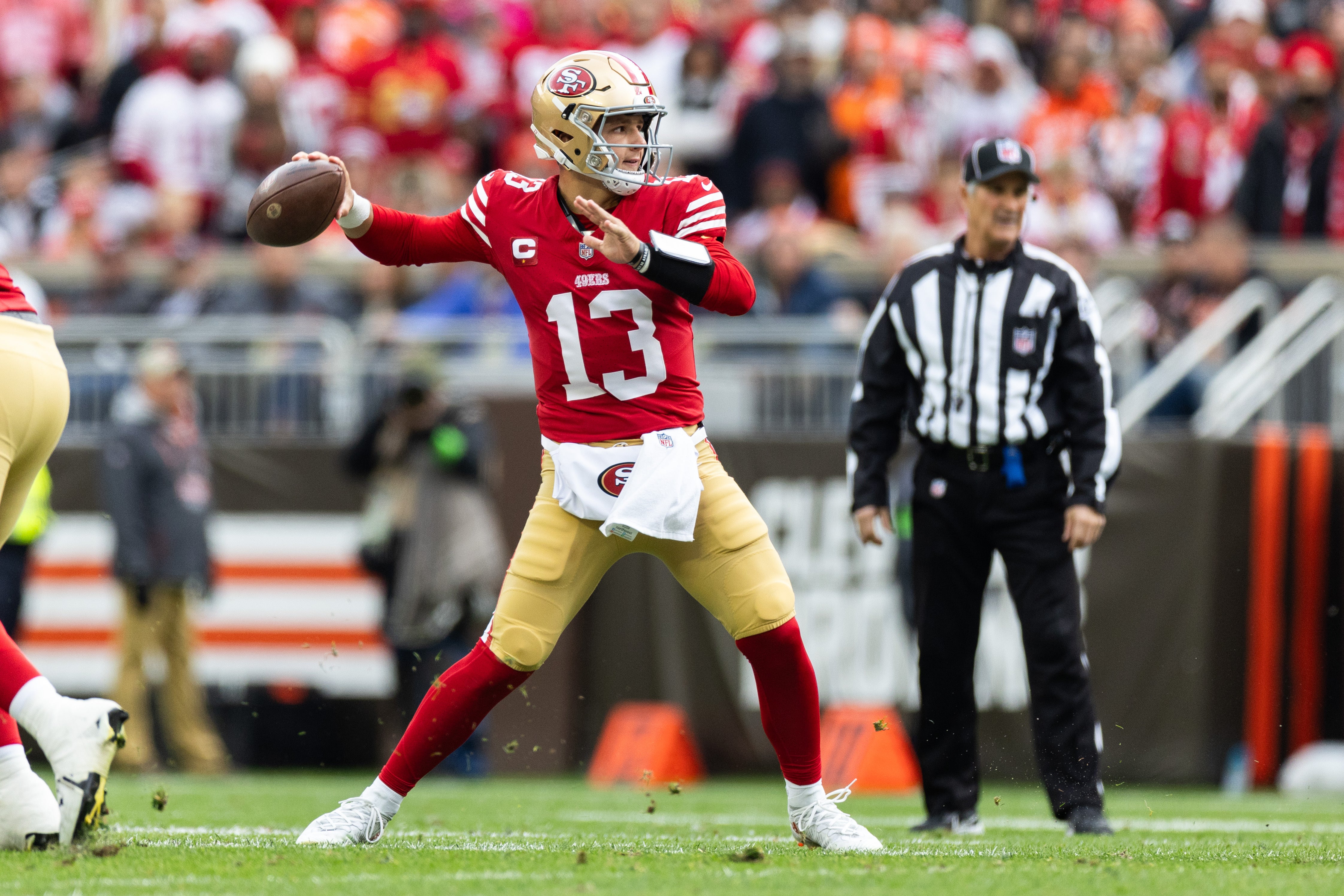 Oct 15, 2023; Cleveland, Ohio, USA; San Francisco 49ers quarterback Brock Purdy (13) throws the ball against the Cleveland Browns during the first quarter at Cleveland Browns Stadium.
