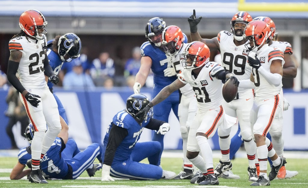 Cleveland Browns cornerback Denzel Ward (21) celebrates after an interception during a game against the Indianapolis Colts at Lucas Oil Stadium.