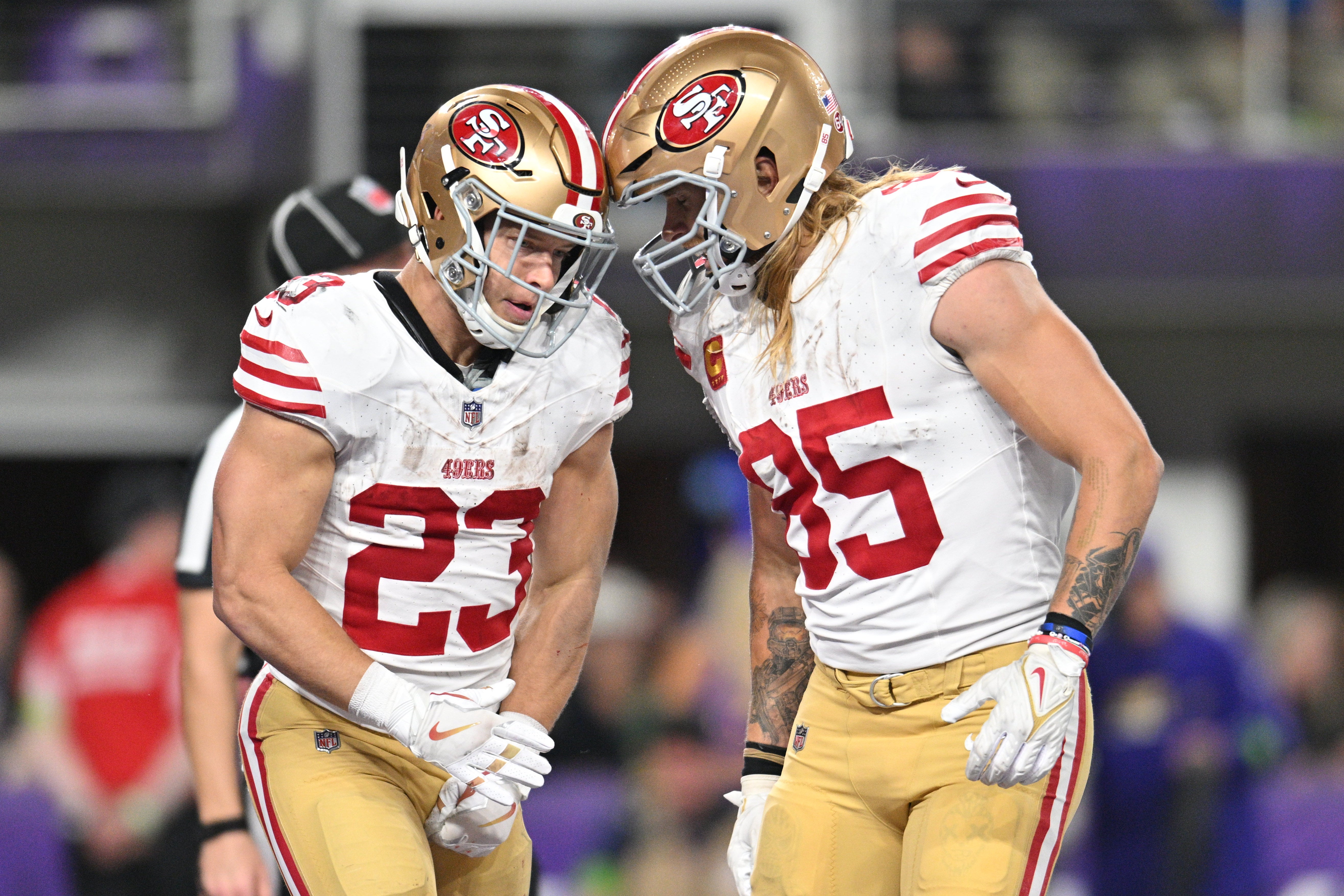 Oct 23, 2023; Minneapolis, Minnesota, USA; San Francisco 49ers running back Christian McCaffrey (23) and tight end George Kittle (85) react after a touchdown by McCaffrey against the Minnesota Vikings during the third quarter at U.S. Bank Stadium.