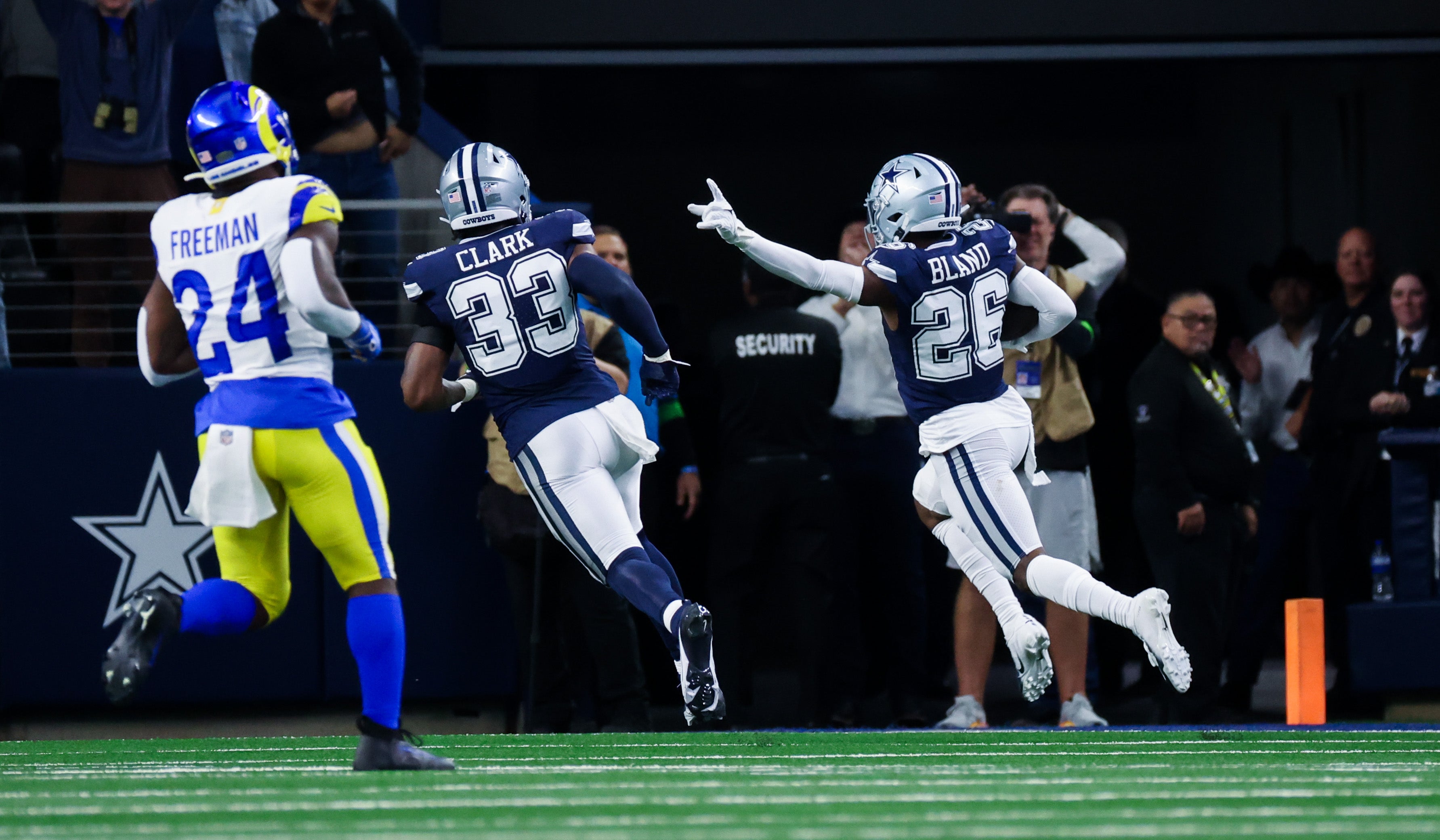 Dallas Cowboys cornerback DaRon Bland (26) scores a touchdown on an interception during the first quarter against the Los Angeles Rams at AT&T Stadium.