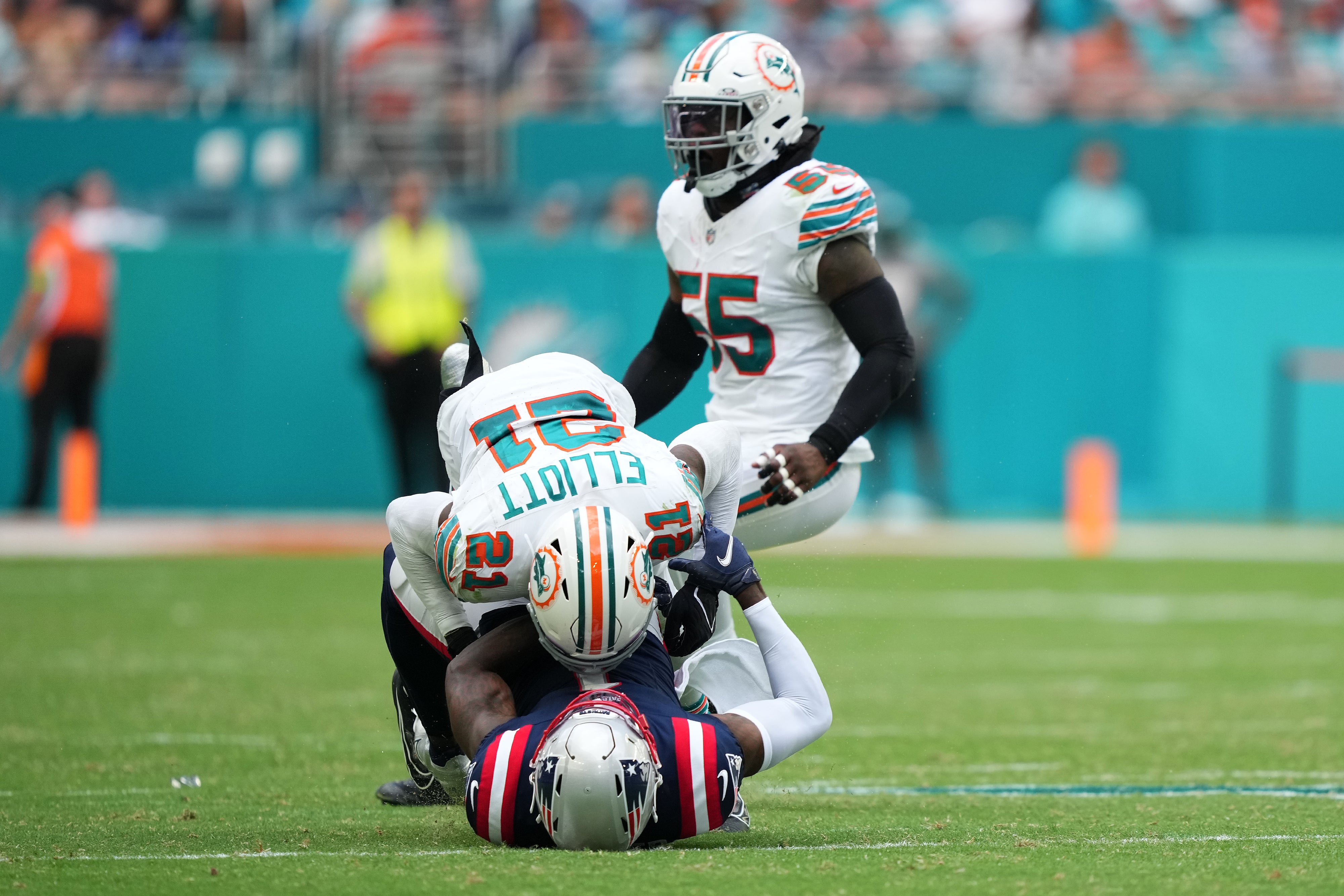 DeVante Parker is hit hard during the Patriots loss to the Miami Dolphins