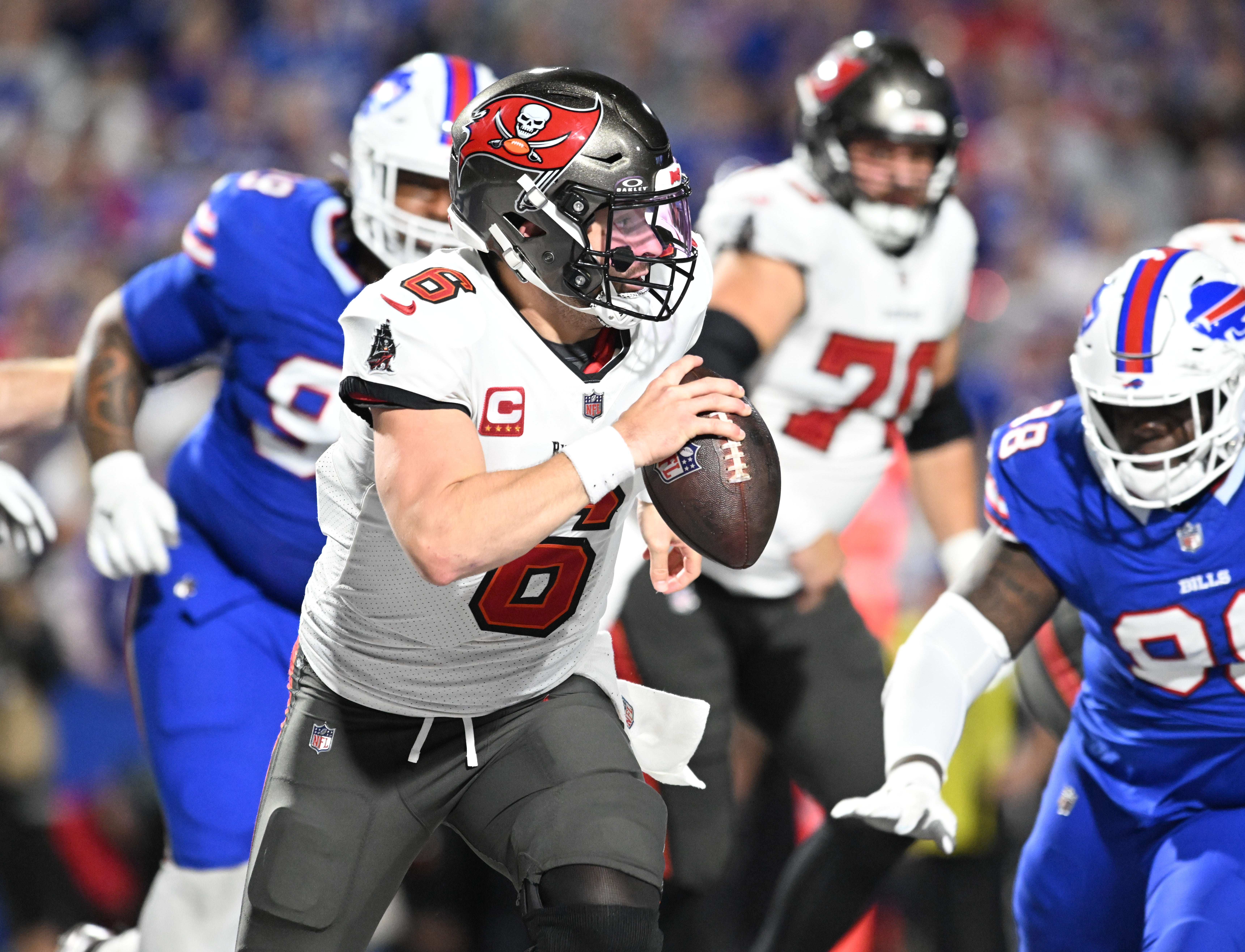 Oct 26, 2023; Orchard Park, New York, USA; Tampa Bay Buccaneers quarterback Baker Mayfield (6) runs out of the pocket in the fourth quarter under pressure by the Buffalo Bills at Highmark Stadium. Mandatory Credit: Mark Konezny-USA TODAY Sports