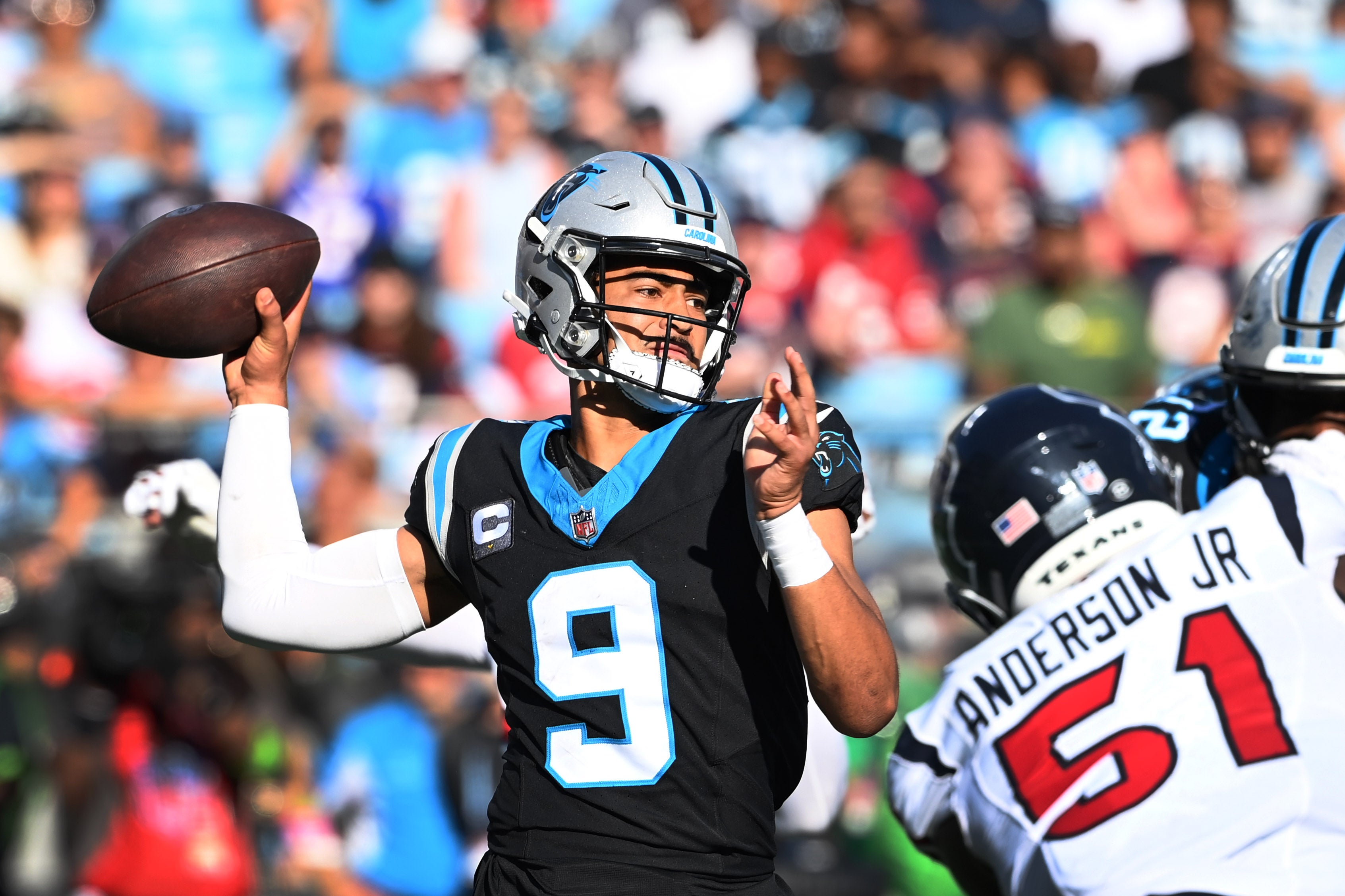 Oct 29, 2023; Charlotte, North Carolina, USA; Carolina Panthers quarterback Bryce Young (9) passes the ball as Houston Texans defensive end Will Anderson Jr. (51) pressures in the fourth quarter at Bank of America Stadium. Mandatory Credit: Bob Donnan-USA TODAY Sports  