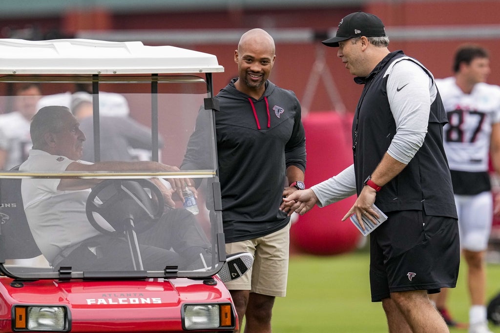Atlanta Falcons GM Terry Fontenot talks with owner Arthur Blank and HC Arthur smith.