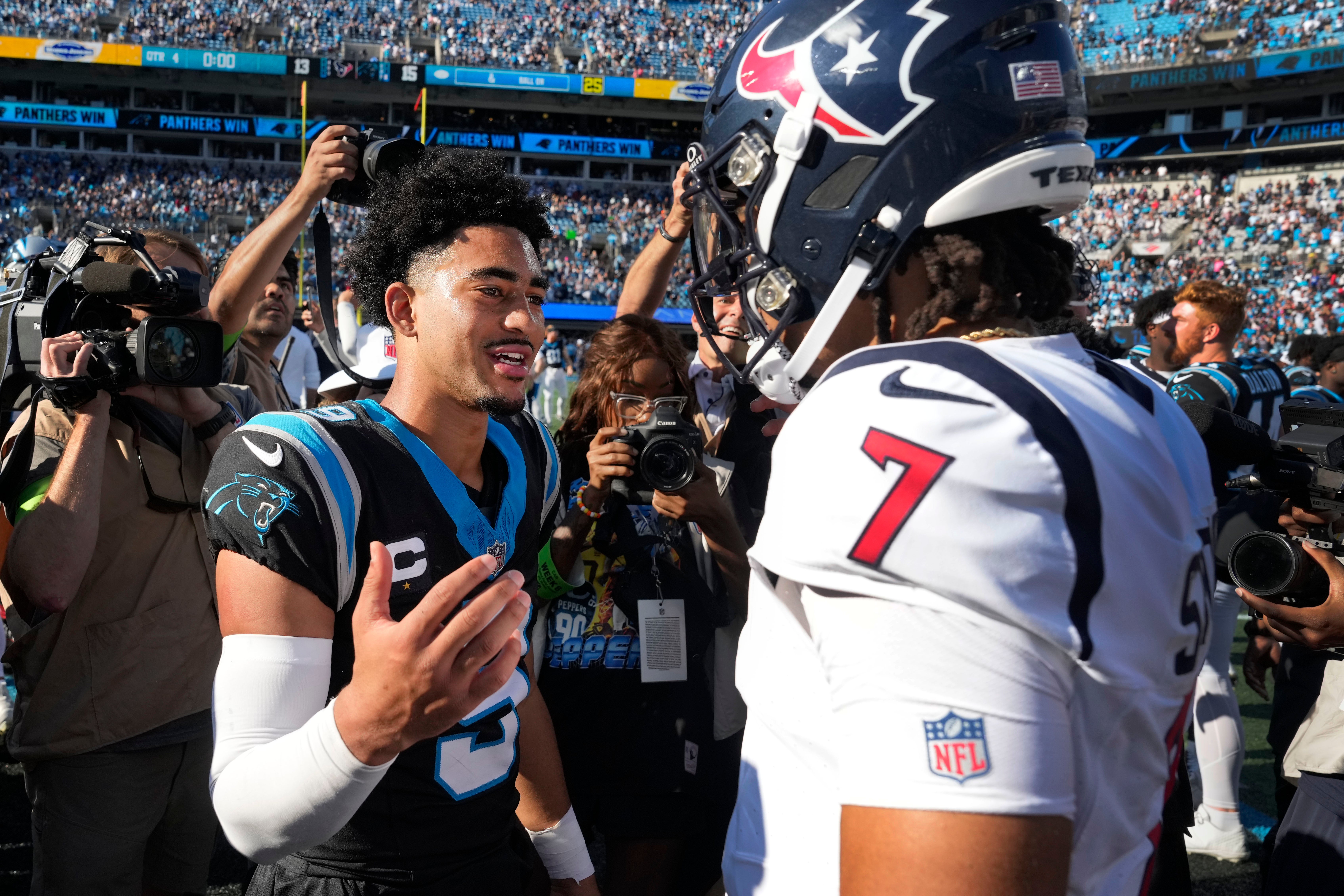 Oct 29, 2023; Charlotte, North Carolina, USA; Carolina Panthers quarterback Bryce Young (9) with Houston Texans quarterback C.J. Stroud (7) after the game at Bank of America Stadium. Mandatory Credit: Bob Donnan-USA TODAY Sports