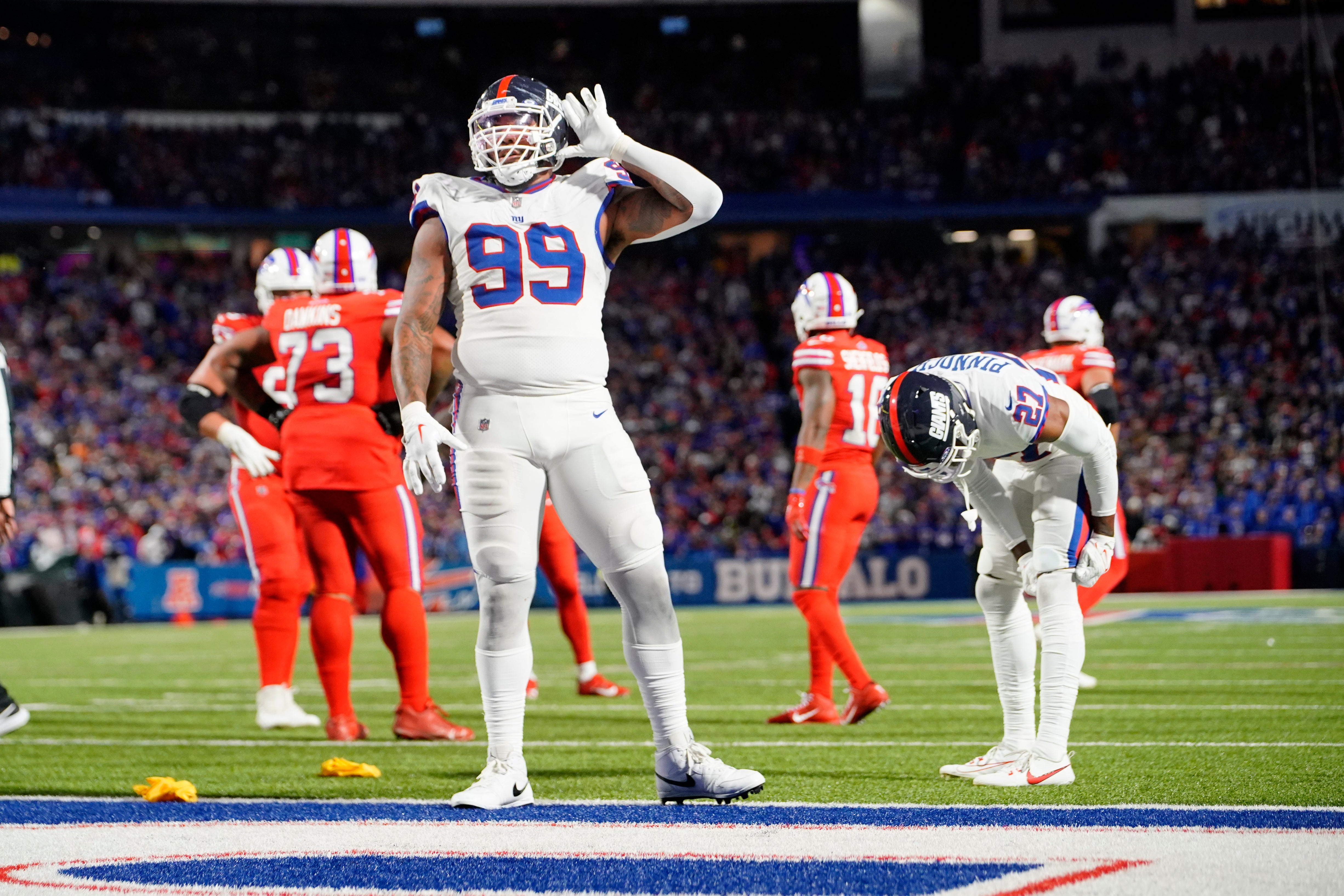 Oct 15, 2023; Orchard Park, New York, USA; New York Giants defensive end Leonard Williams (99) lets the crowd know he can t hear them during the second half against the Buffalo Bills at Highmark Stadium.