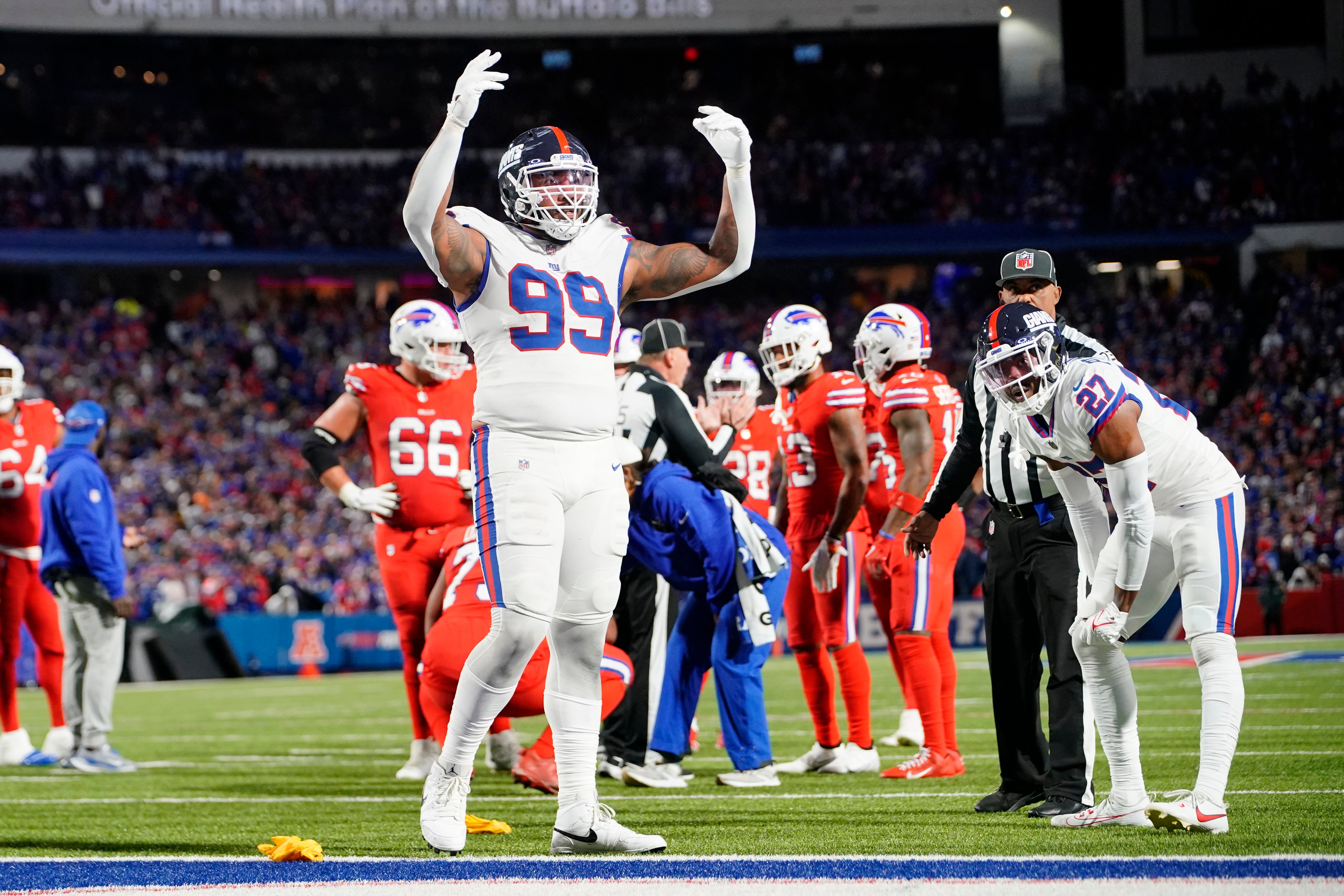 Oct 15, 2023; Orchard Park, New York, USA; New York Giants defensive end Leonard Williams (99) encourages the crowd to get loud during the second half against the Buffalo Bills at Highmark Stadium.