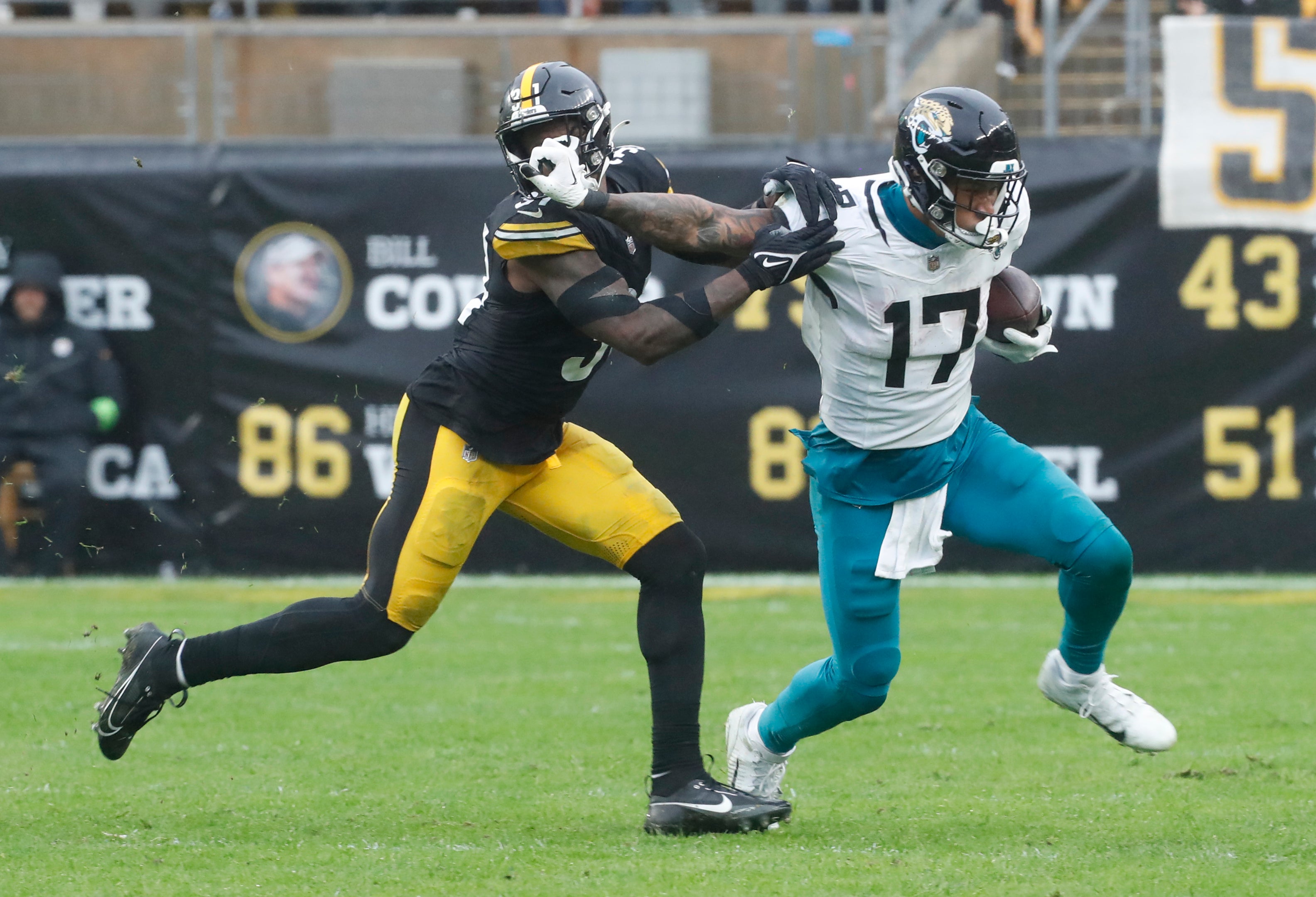Oct 29, 2023; Pittsburgh, Pennsylvania, USA; Jacksonville Jaguars tight end Evan Engram (17) runs after a catch as Pittsburgh Steelers safety Keanu Neal (31) defends during the fourth quarter at Acrisure Stadium. Jacksonville won 20-10. Mandatory Credit: Charles LeClaire-USA TODAY Sports
