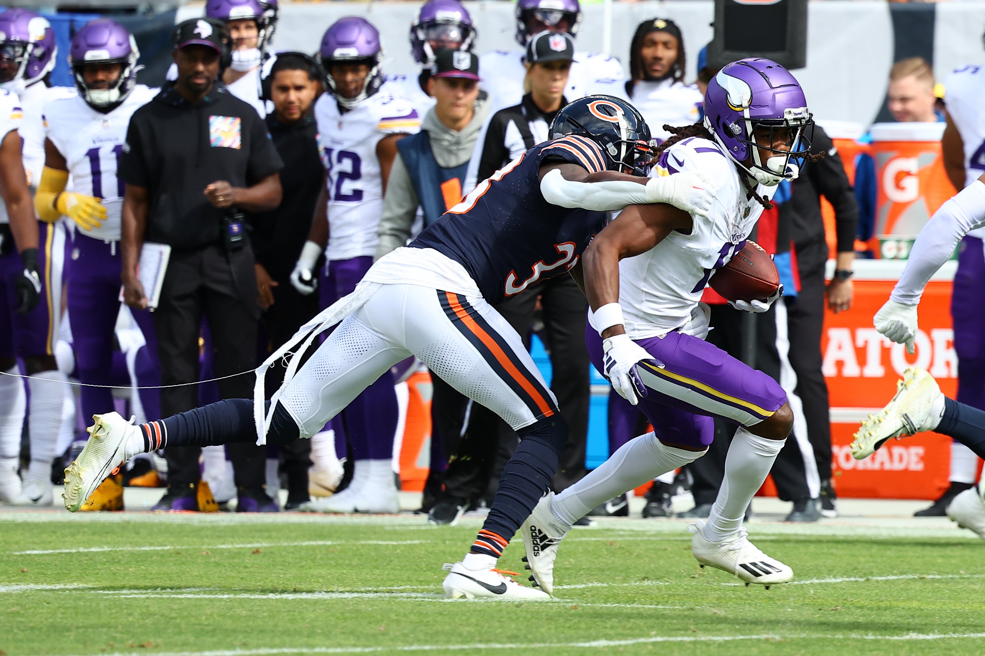 Oct 15, 2023; Chicago, Illinois, USA; Minnesota Vikings wide receiver K.J. Osborn (17) makes a catch over Chicago Bears cornerback Jaylon Johnson (33) during the first half at Soldier Field.
