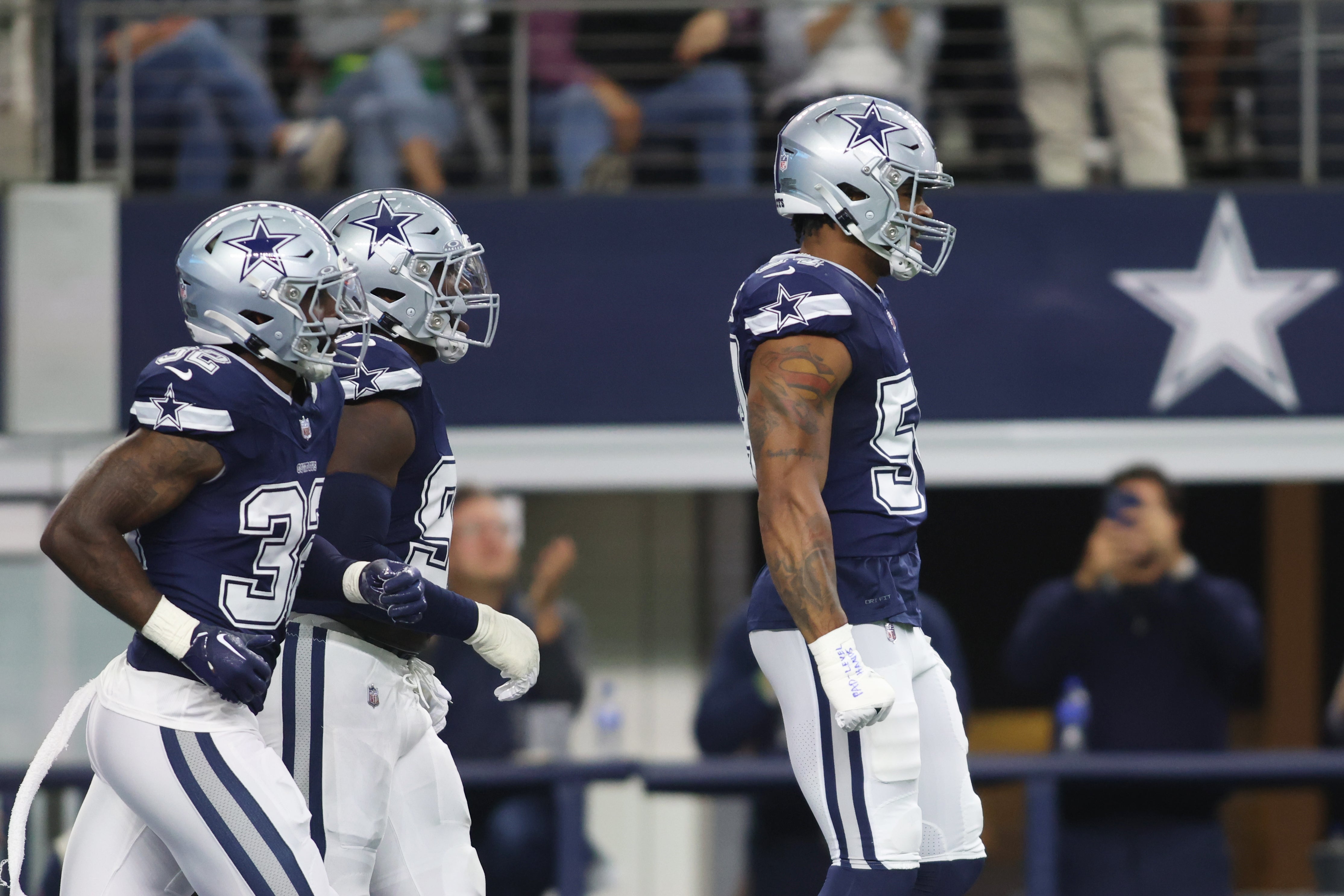 Dallas Cowboys defensive end Sam Williams (54) reacts after blocking a punt for a safety in the second quarter against the Los Angeles Rams at AT&T Stadium.