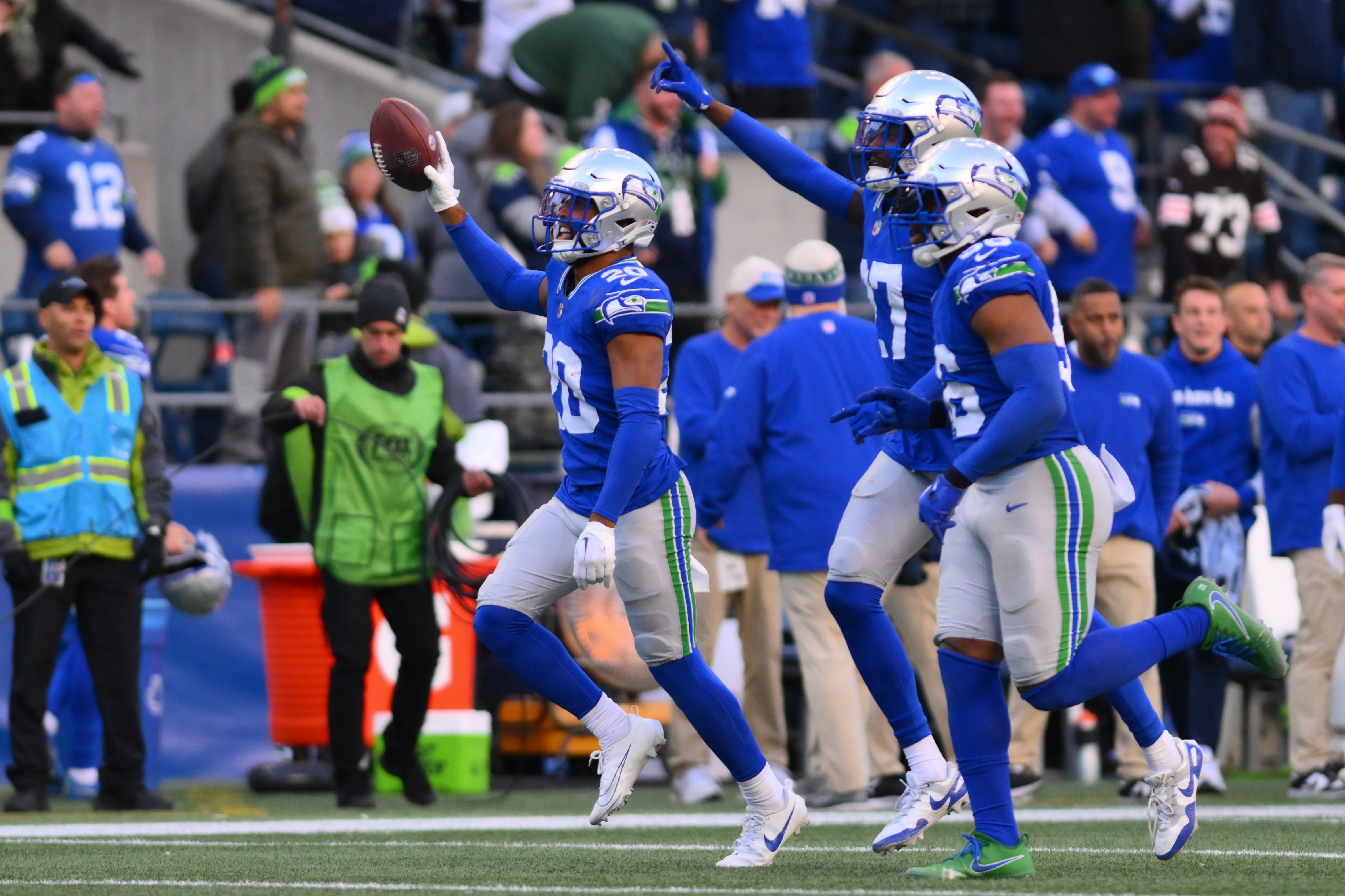 Oct 29, 2023; Seattle, Washington, USA; Seattle Seahawks safety Julian Love (20) celebrates after intercepting the ball against the Cleveland Browns during the second half at Lumen Field. Mandatory Credit: Steven Bisig-USA TODAY Sports