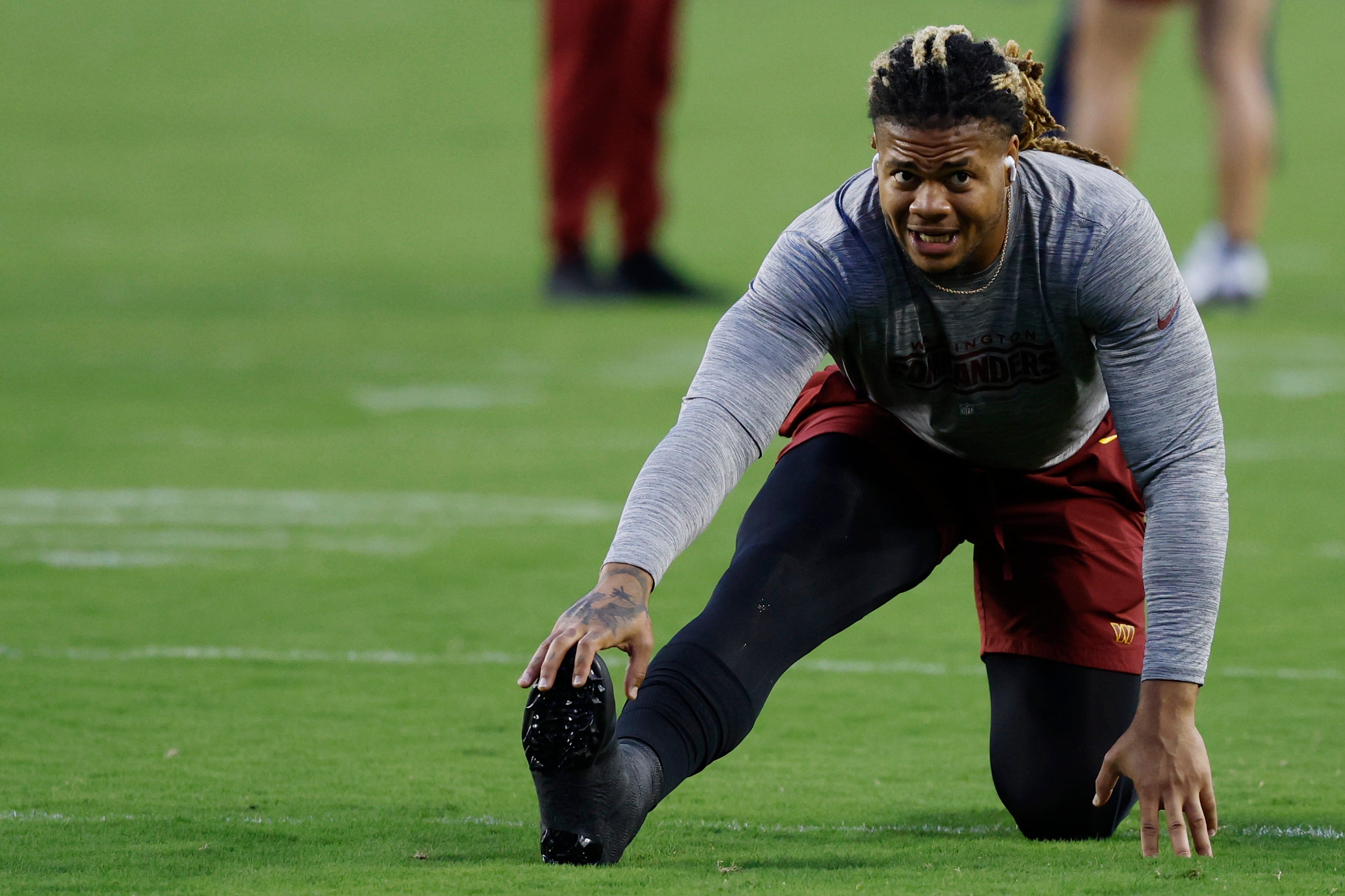 Oct 5, 2023; Landover, Maryland, USA; Washington Commanders defensive end Chase Young stretches on the field prior to warmups before the Commanders' game against the Chicago Bears at FedExField.