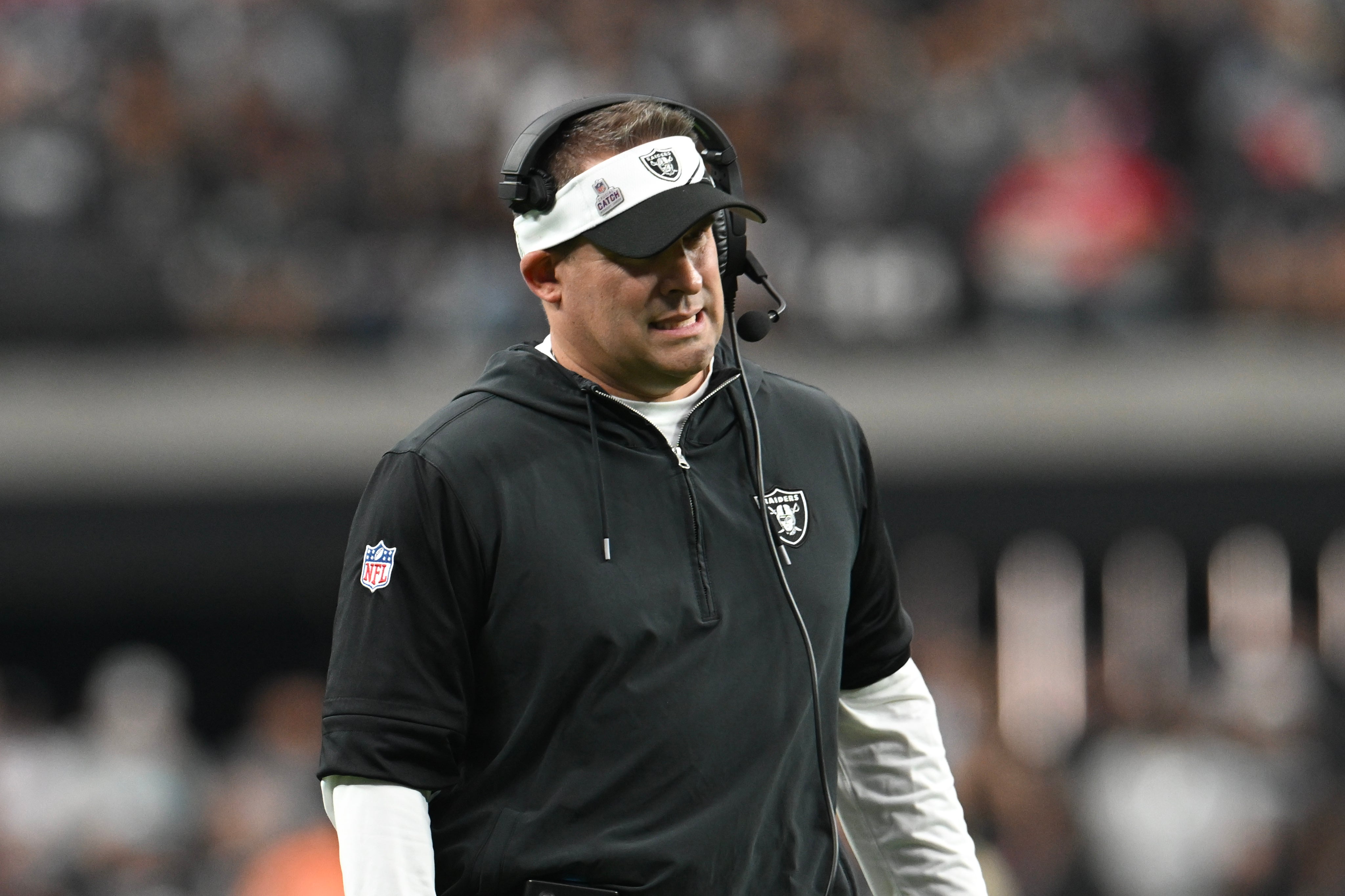 Oct 15, 2023; Paradise, Nevada, USA; Las Vegas Raiders head coach Josh McDaniels looks down field against the New England Patriots in the fourth quarter at Allegiant Stadium.