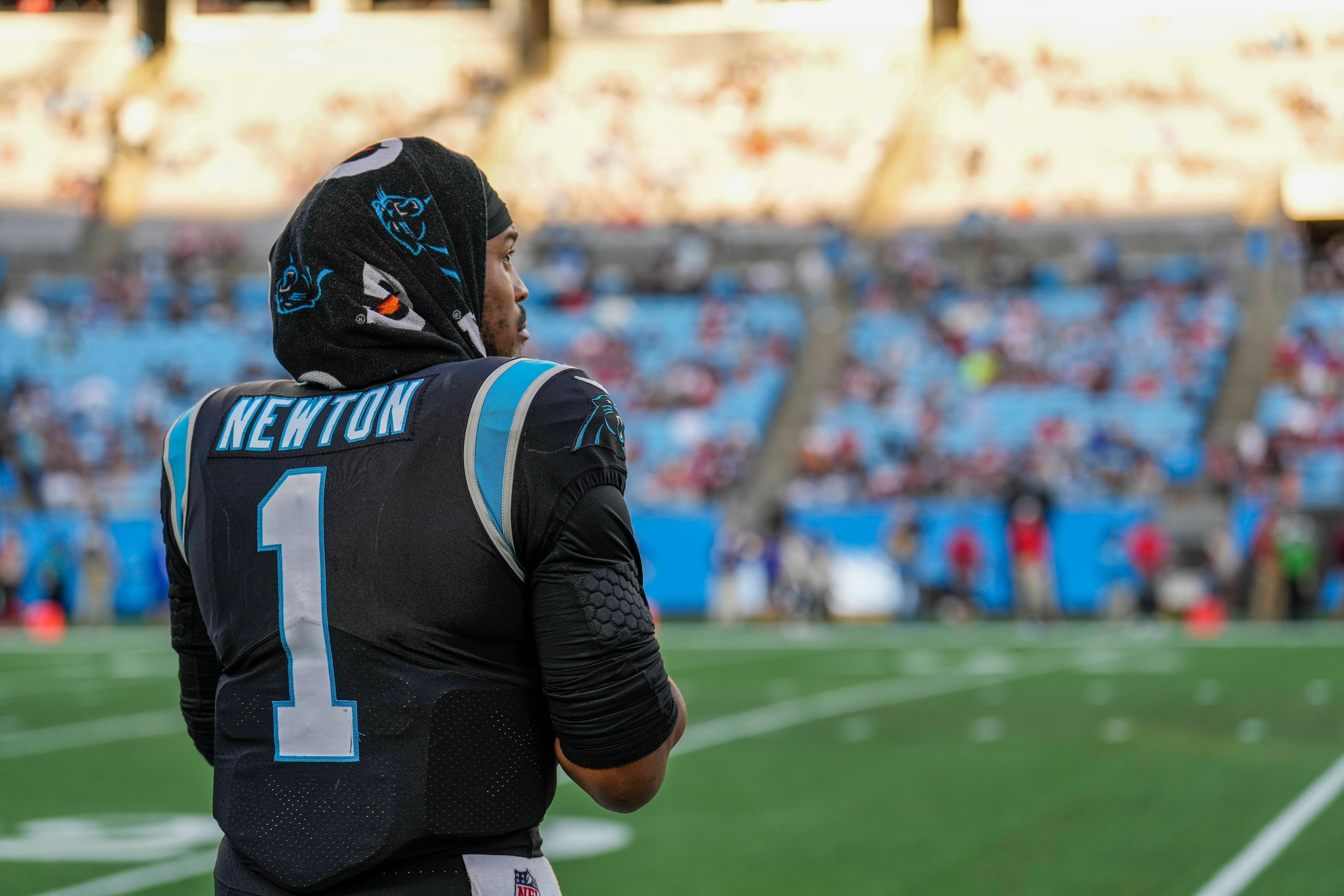 Dec 26, 2021; Charlotte, North Carolina, USA; Carolina Panthers quarterback Cam Newton (1) looks on in the second half against the Tampa Bay Buccaneers at Bank of America Stadium. Mandatory Credit: Jim Dedmon-USA TODAY Sports