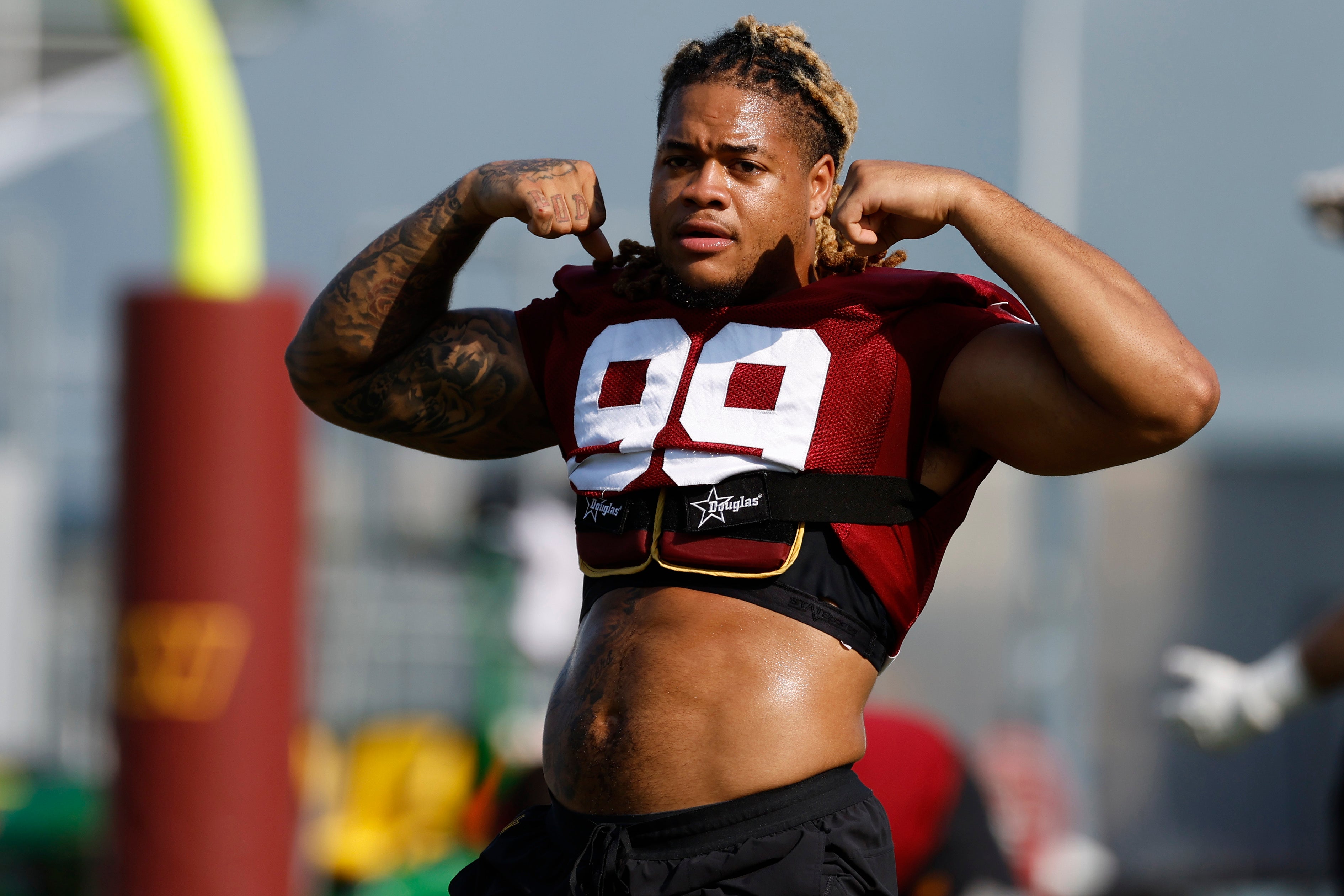 Jul 28, 2023; Ashburn, VA, USA; Washington Commanders defensive end Chase Young (99) gestures on day three of Commanders training camp at OrthoVirginia Training Center.