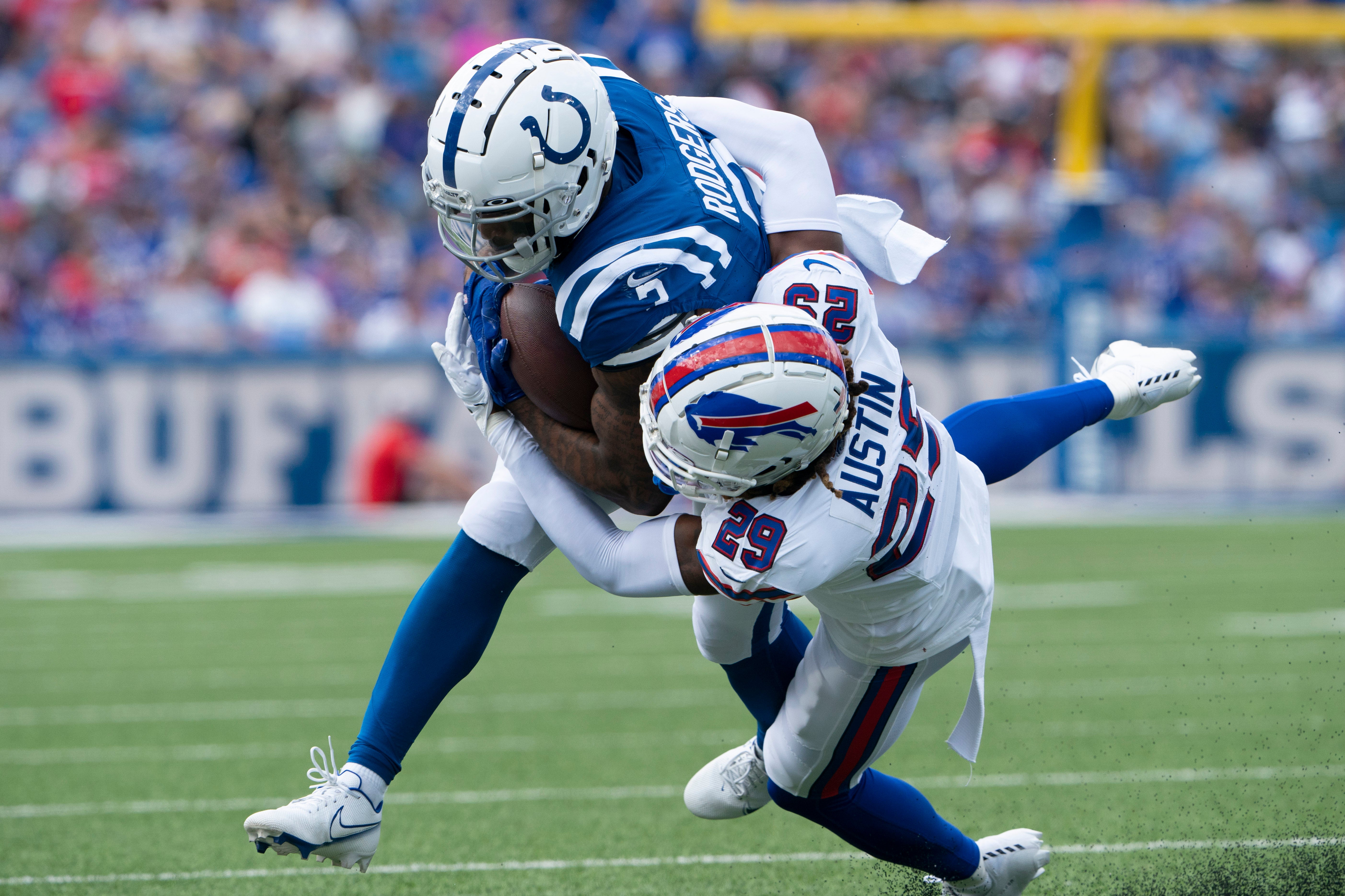 rookie cornerback Alex Austin tackles Indianapolis Colts wide receiver Amari Rodgers