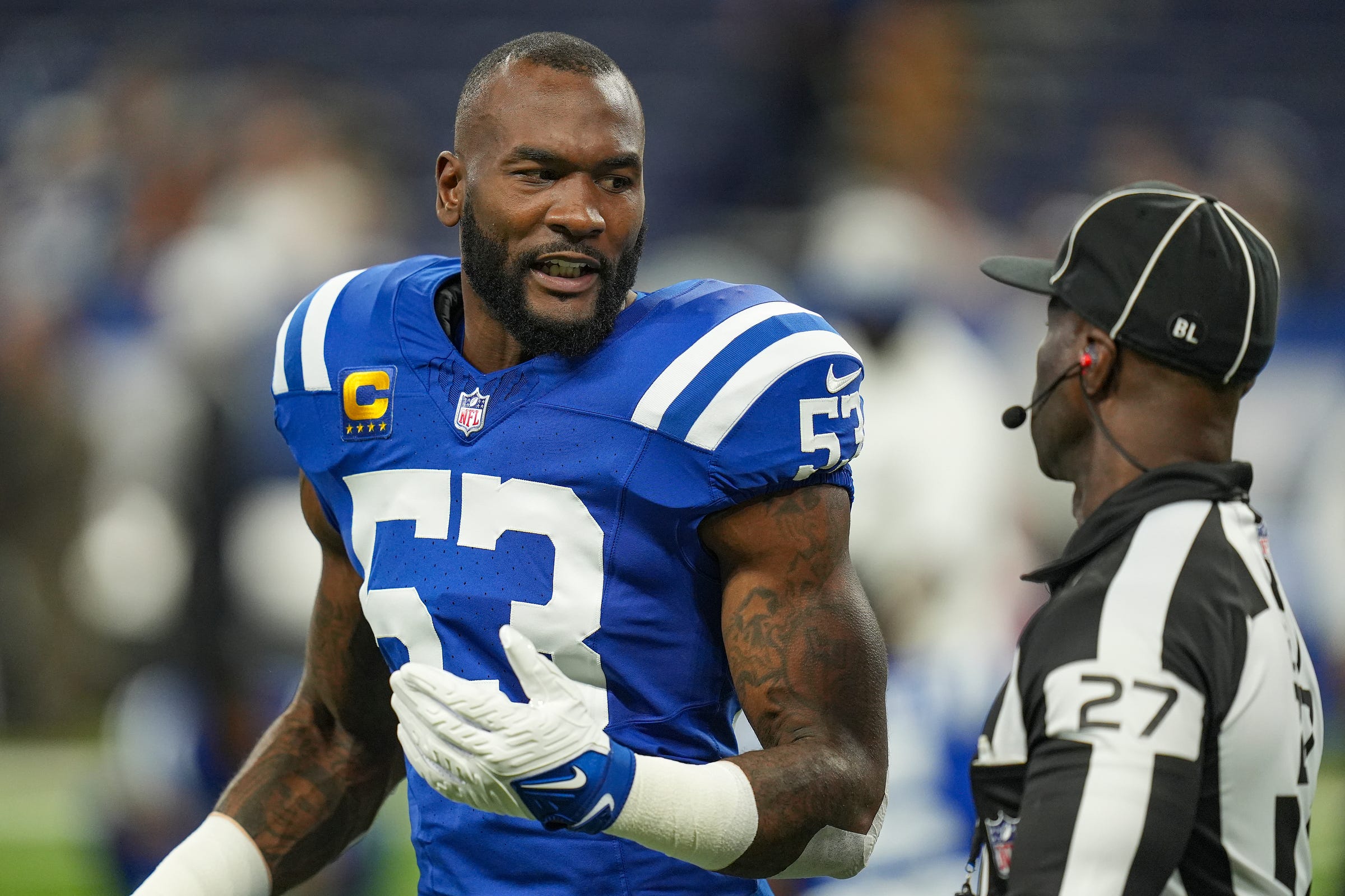 Indianapolis Colts linebacker Shaquille Leonard (53) talks to game official Grantis Bell on Sunday, Oct. 29, 2023, before facing the New Orleans Saints at Lucas Oil Stadium in Indianapolis.