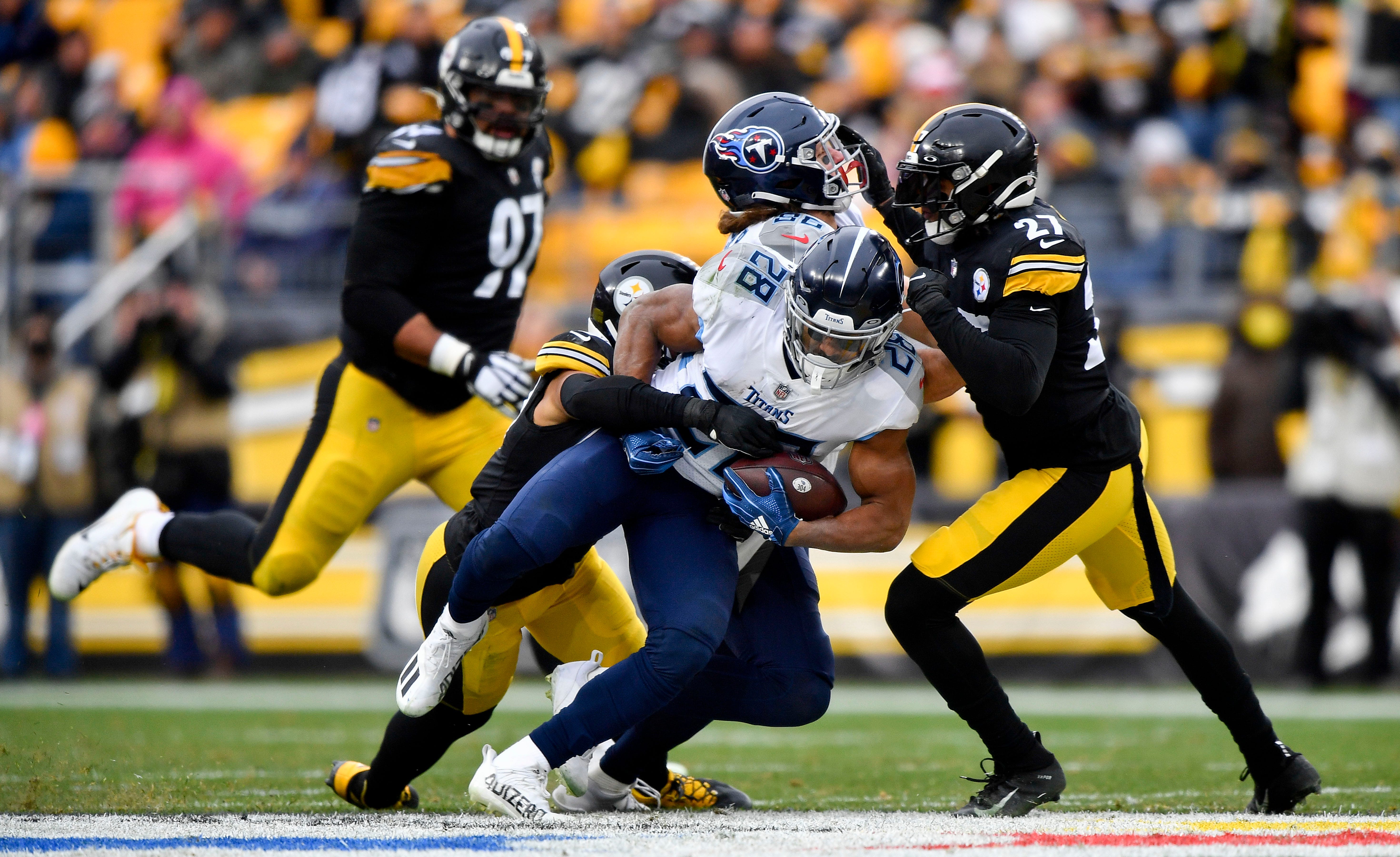 Tennessee Titans running back Jeremy McNichols (28) gets stopped but the Steelers defense during the third quarter at Heinz Field Sunday, Dec. 19, 2021 in Pittsburgh, Pa. Titans Steelers 093